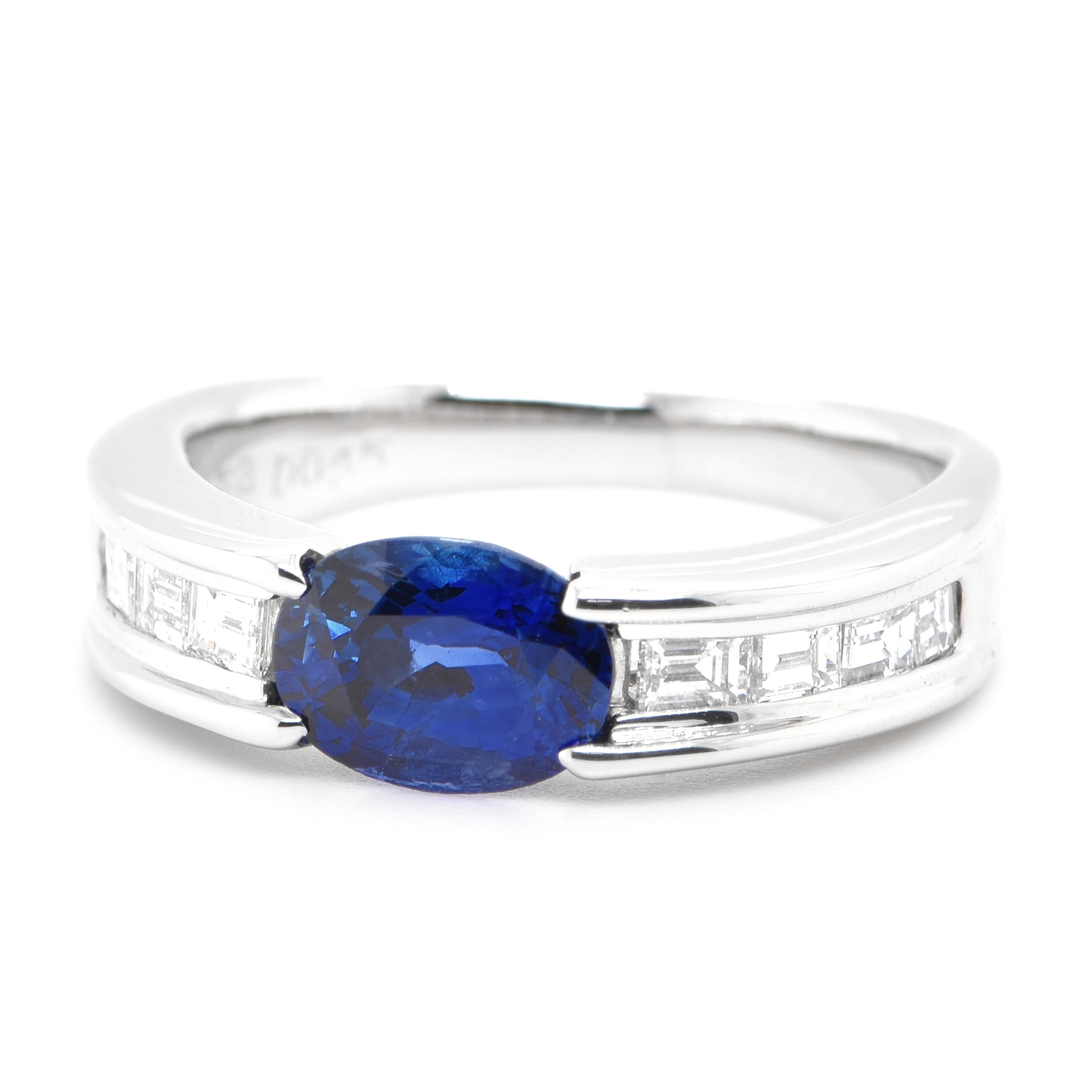 A beautiful band ring featuring a 1.53 Carat Natural Blue Sapphire and 0.45 Carats Diamond Accents set in Platinum. Sapphires have extraordinary durability - they excel in hardness as well as toughness and durability making them very popular in