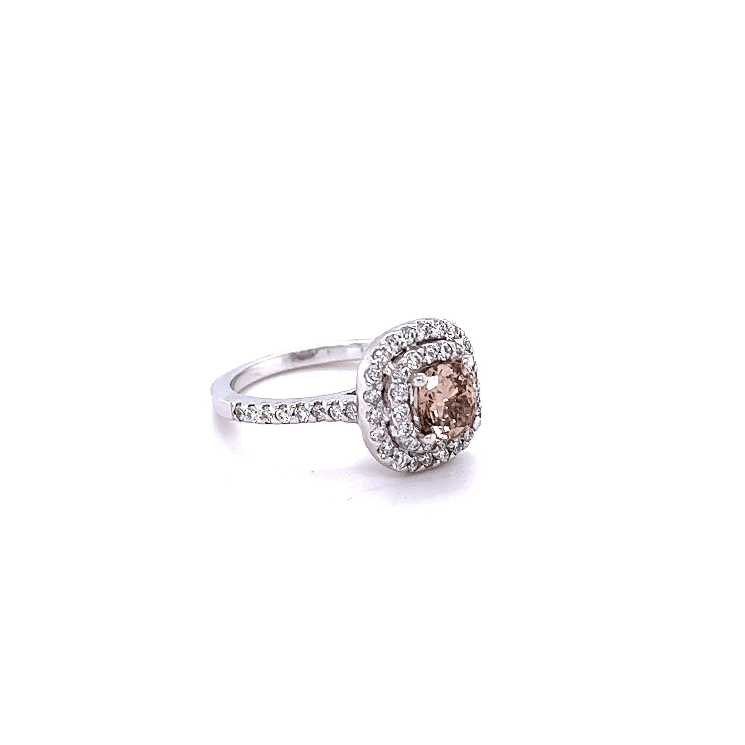 This ring has a Natural Cushion Cut Champagne Brown Diamond that weighs 0.95 carats and has a clarity of VS. It is surrounded by 54 Round Cut White Diamonds that weigh 0.58 carats and have a clarity of VS and color of F. 
The center champagne