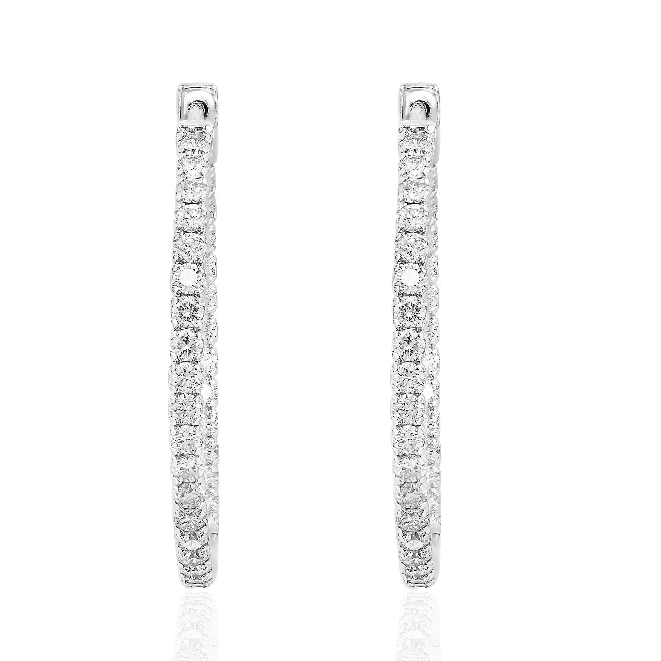 A chic and fashionable pair of hoop earrings showcasing  round diamonds, set in 14k white gold.  Round diamonds weigh 1.53 carats total. A beautiful piece of jewelry.


All diamonds are GH color SI1 Clarity.
Available in Yellow and Rose Gold as