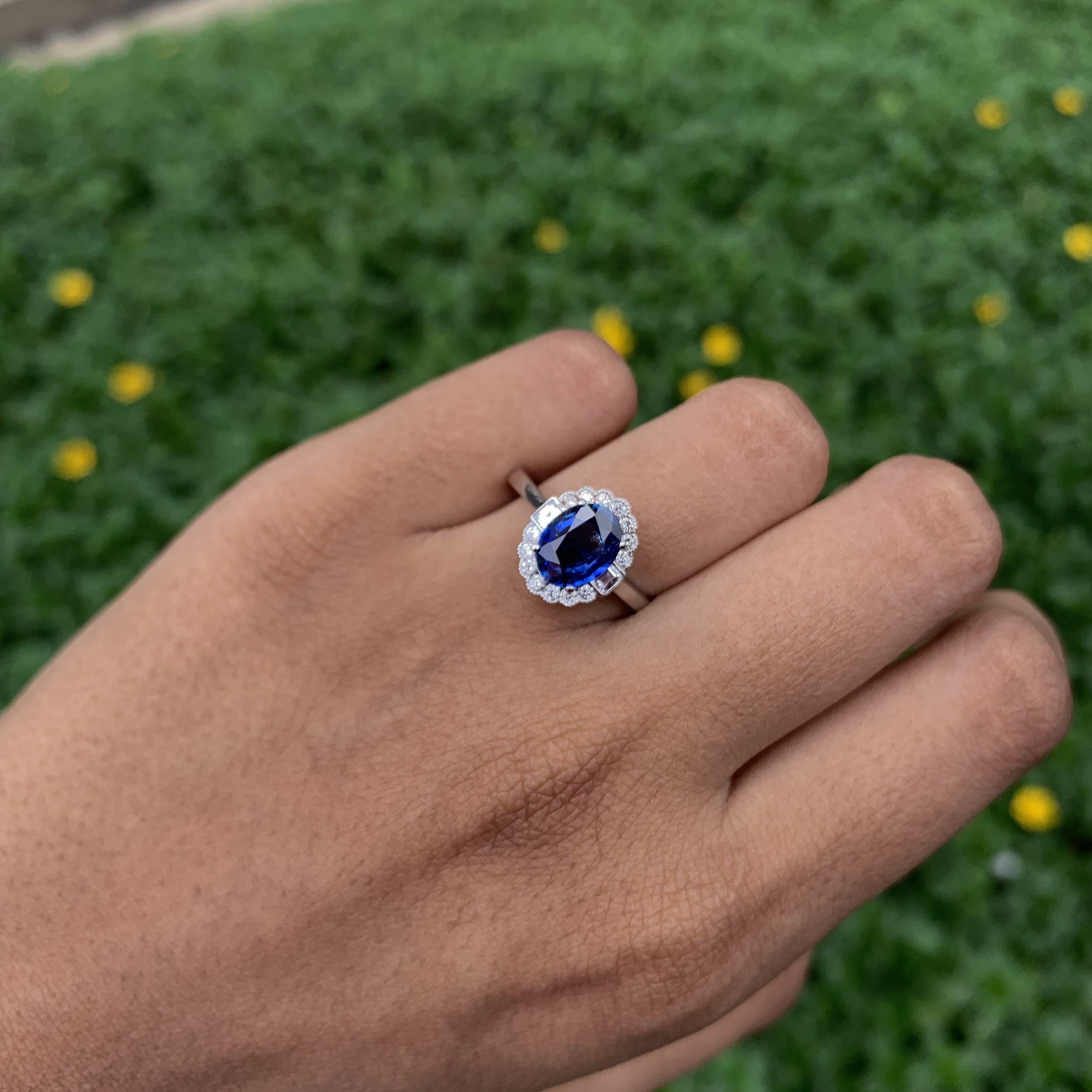 Oval Cut 1.53 Carat Royal Blue Ceylon Sapphire Ring with Halo Diamonds in 18K Gold For Sale