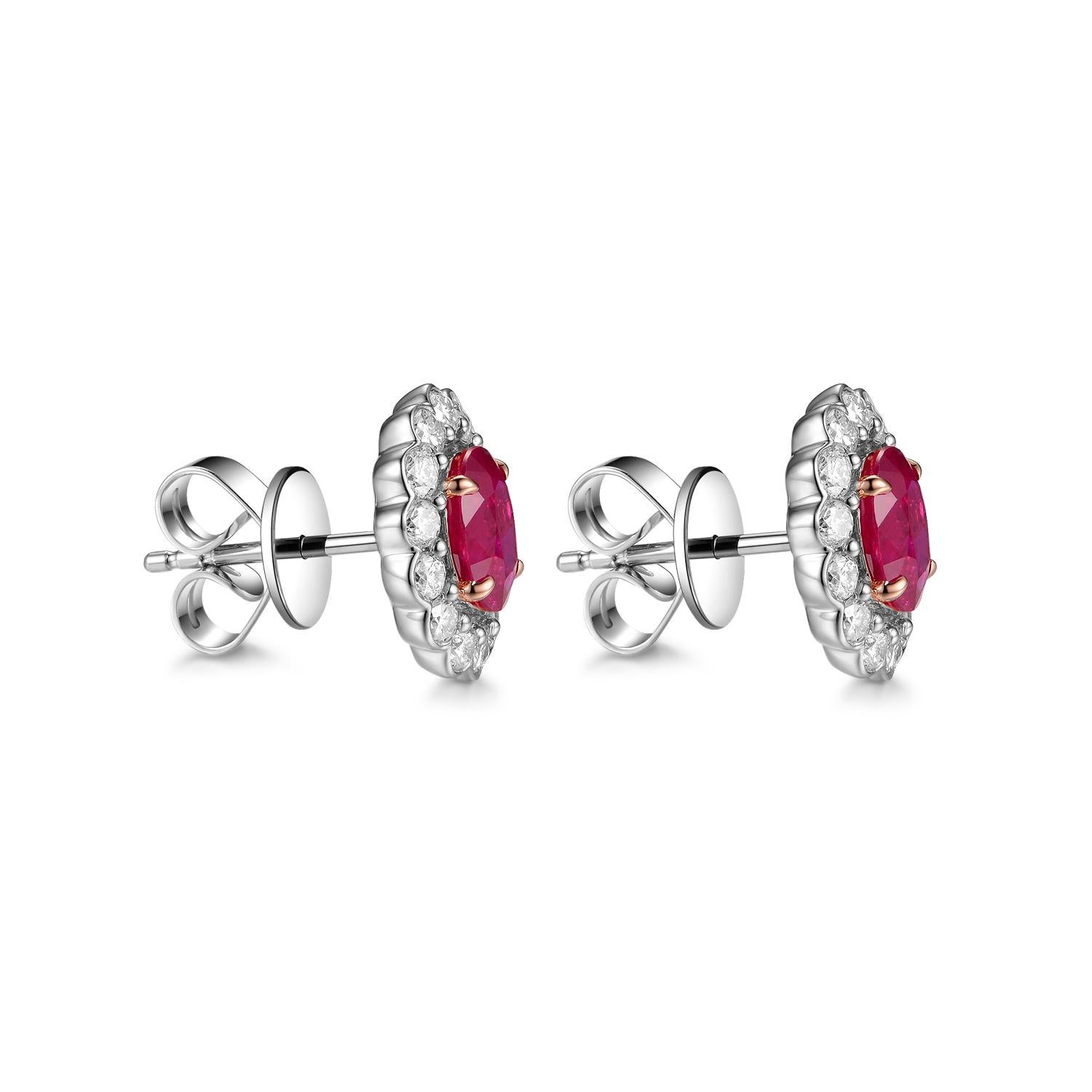 This dainty earring features 1.53 carats of oval shape ruby (0.765 carat each side), assented with 0.63 carat of diamond halo. This earring is set in 18 karat white gold, the prongs are made with 18 karat rose gold. Truly a special gift for that