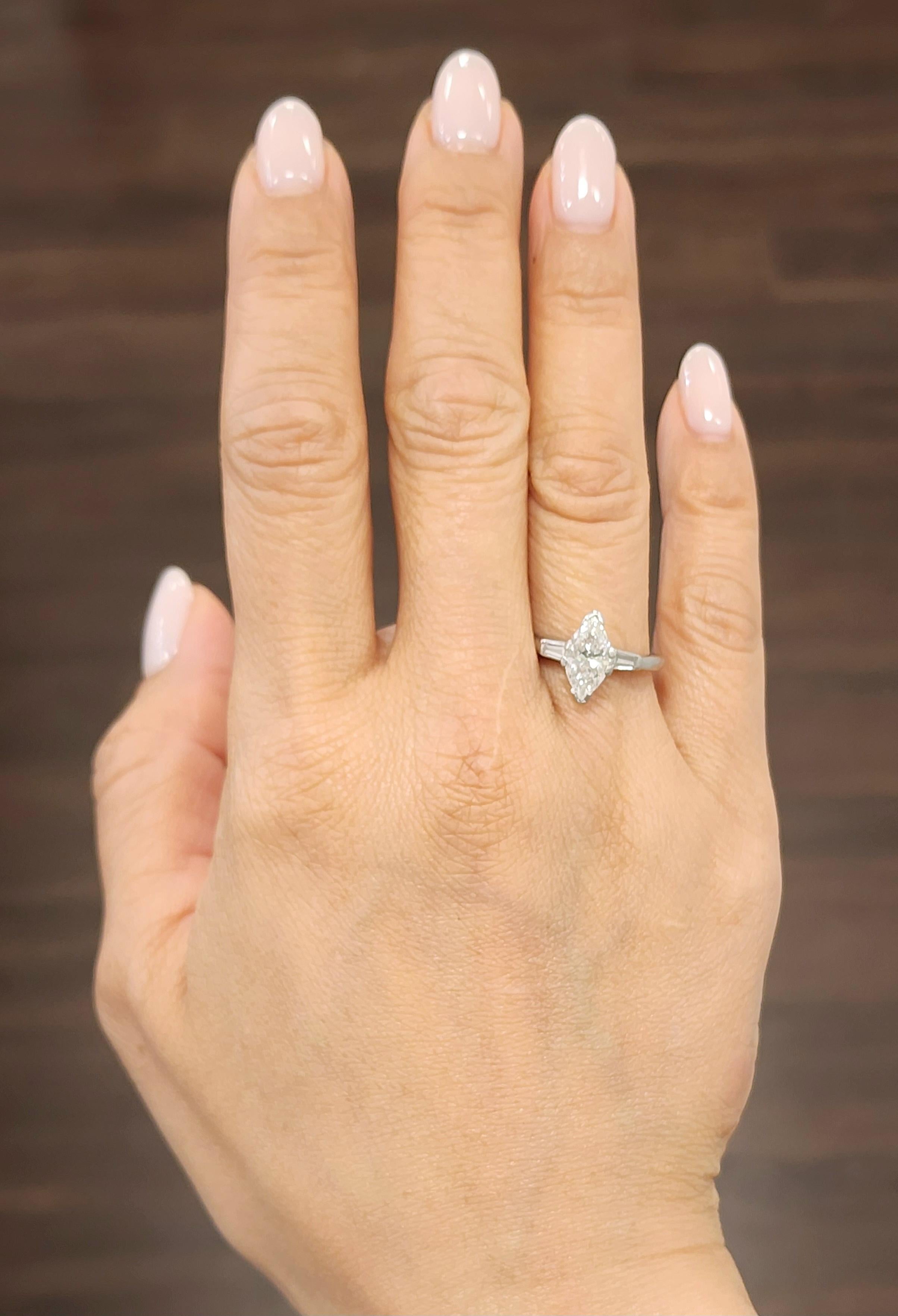 This stunning ring features a 1.33 ct marquis set in platinum with 2 baguettes on the side. The diamonds boast a color of G/H and I1/I2 in clarity. A beautiful ring to adorn anyone's finger.