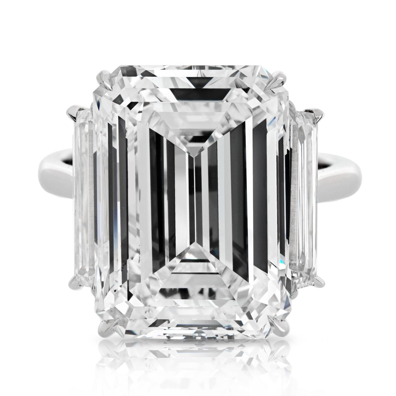 Elevate your love story with the epitome of opulence – an extraordinary engagement ring featuring a captivating 15.30-carat Emerald Cut diamond as its centerpiece. Certified by GIA, this remarkable gem boasts a rare I color grade and flawless