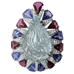 15.31 carats, carved Aquamarine, Rubellite, Tanzanite & Diamonds Cocktail Ring