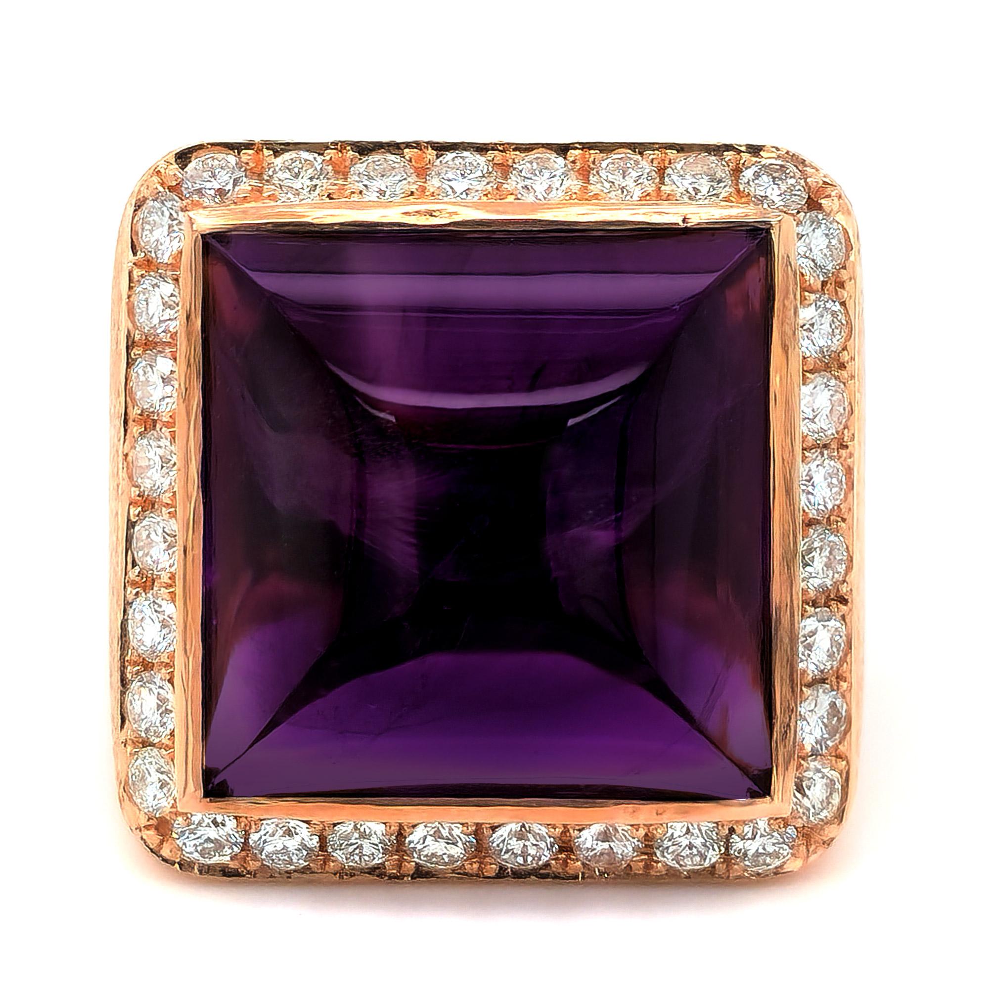 A color that has a glorious avatar, here is a 15.31 carat Sugarloaf Amethyst that comes set with diamonds around adding a little sparkle. Allowing light to create the spectacle intended, this beautiful gemstone has unmatched brilliance.

Ring