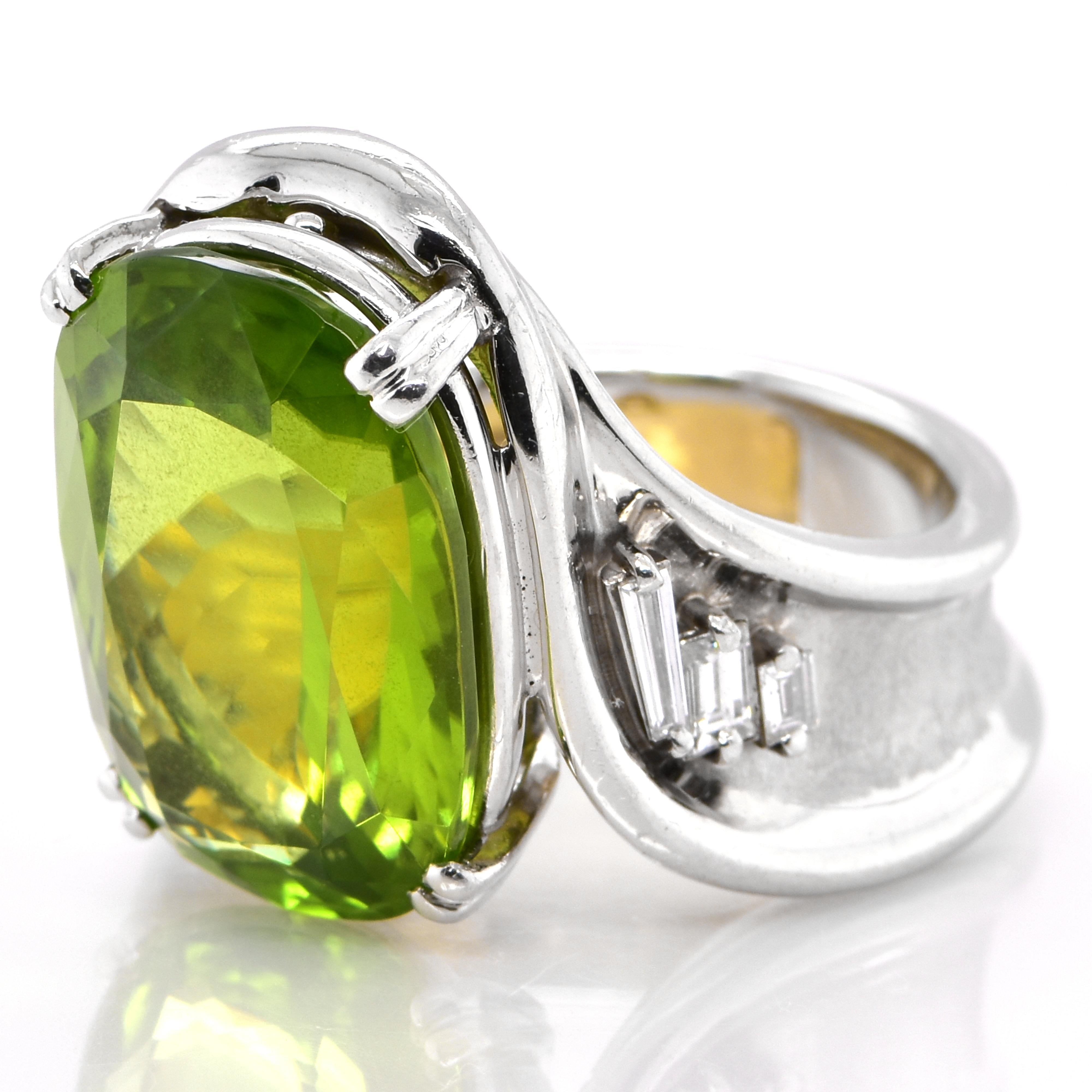 A beautiful Cocktail ring featuring a 15.32 Carat Natural Peridot and 0.26 Carats Diamond Accents set in 18 Karat Yellow Gold and Platinum. Peridot is the birthstone of the month of August. Peridot is one of the few gemstones that occur in only one