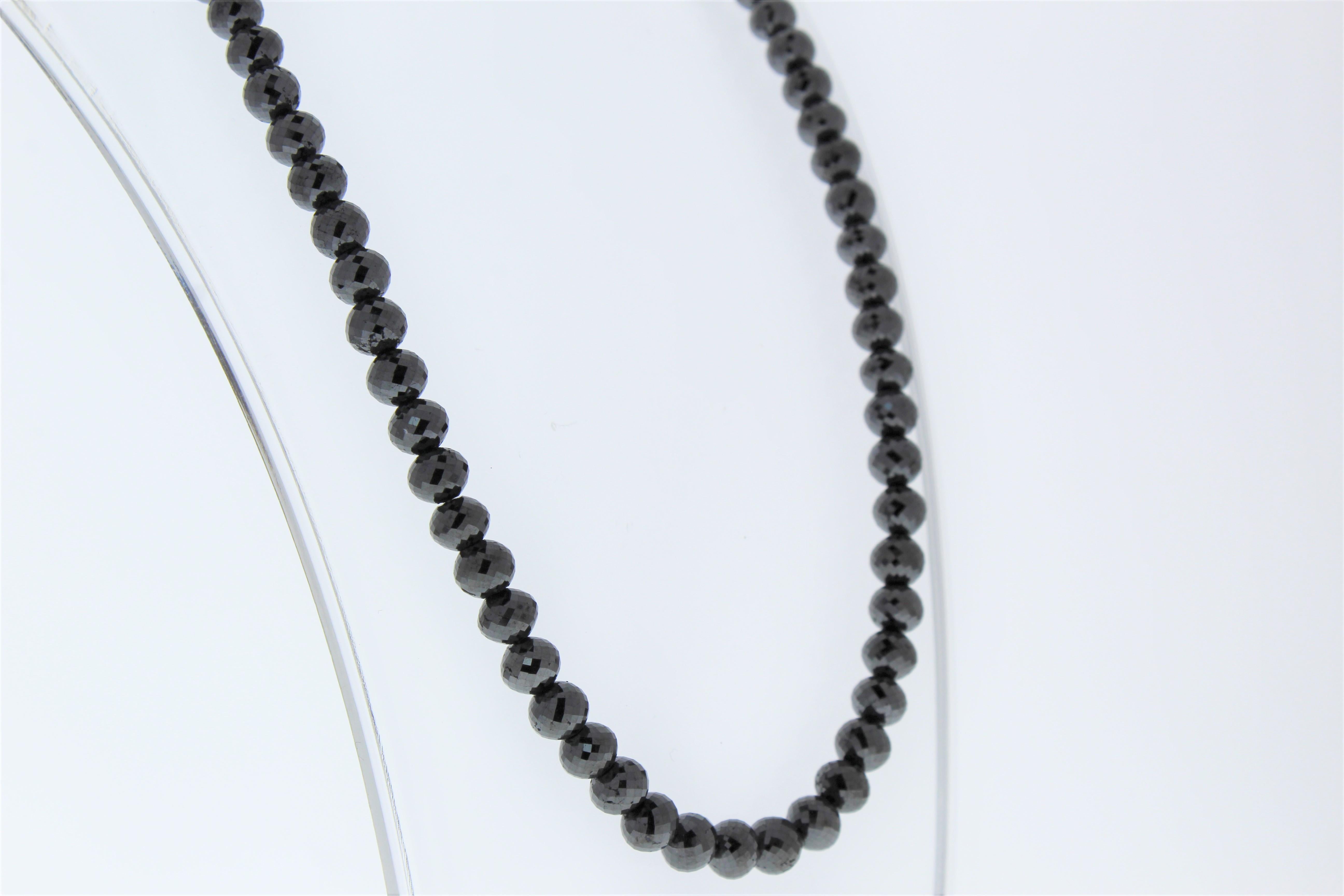 This necklace is a dramatic strand of 81 faceted briolette black diamonds totaling 159.92carats. Slim in design and perfect for layering alongside other necklaces and chains, this black diamond necklace is sure to get noticed.