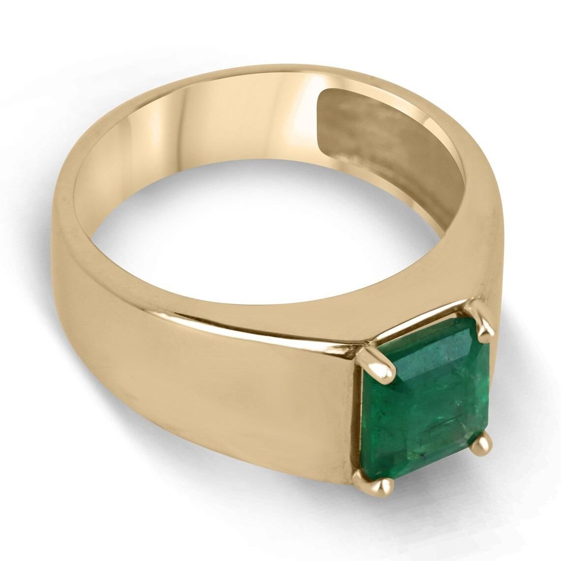 Displayed is a classic emerald solitaire emerald cut men's ring in 14K yellow gold. This solitaire ring carries a full 1.53-carat emerald in a secure prong setting. The emerald has very good clarity with minor flaws that are normal in all genuine