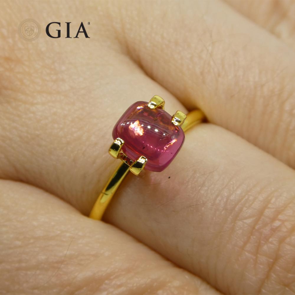 This is a stunning GIA Certified Ruby 

The GIA report reads as follows:

GIA Report Number: 6214962458
Shape: Cushion
Cutting Style: Double Cabochon
Cutting Style: Crown: 
Cutting Style: Pavilion: 
Transparency: Transparent
Color: Purplish