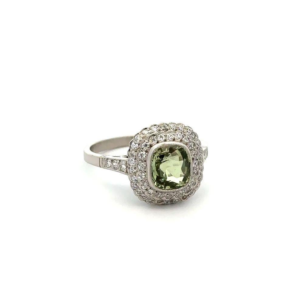 Simply Beautiful! Elegant and finely detailed Double Halo Platinum Ring. Centering a securely nestled Hand set, 1.54 Carat Cushion Alexandrite. Yellowish Green changing to Brownish Yellow. GIA report #5231193075. Surrounded by Old European Cut