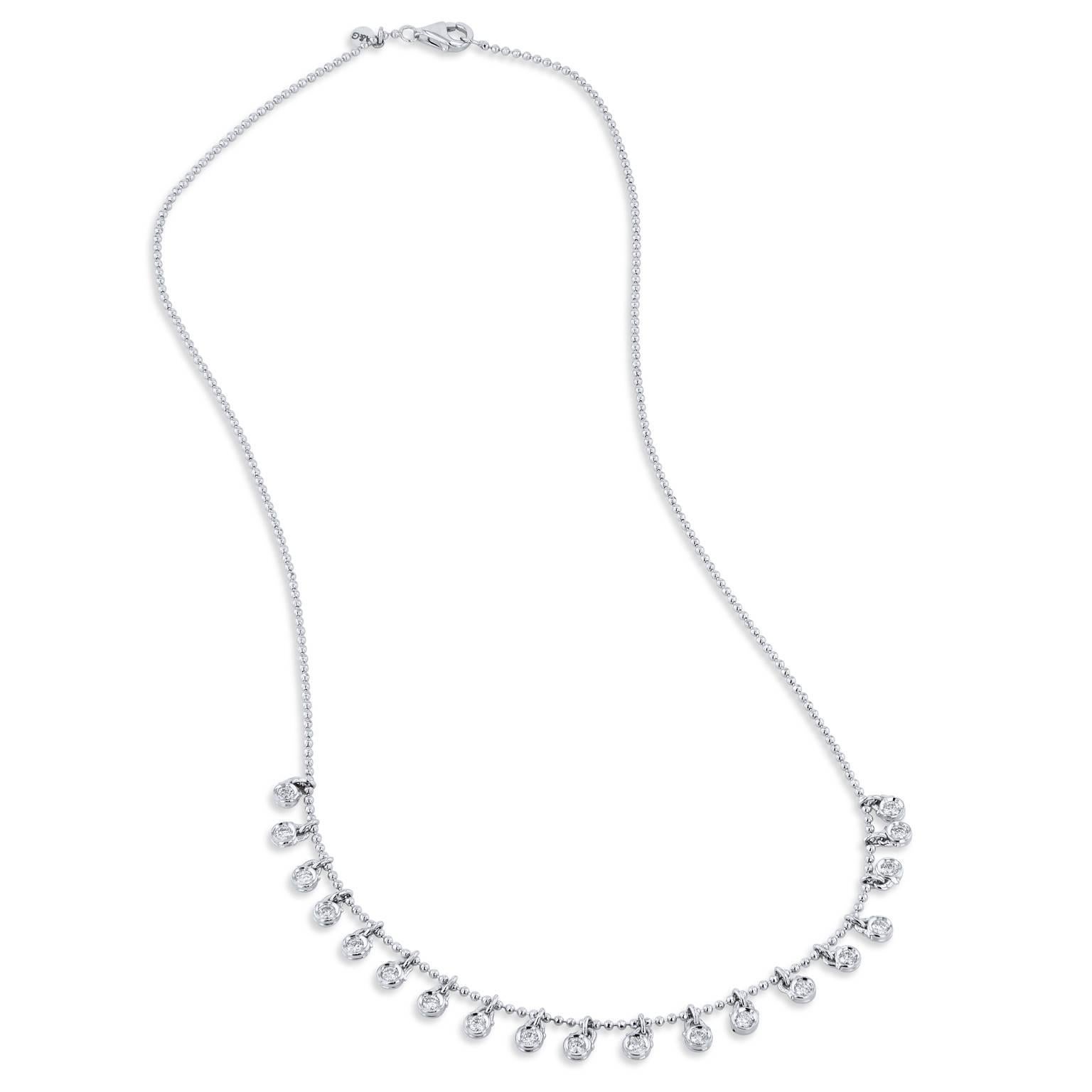 Exude flirty, fun with this 18 karat white gold necklace featuring nineteen bezel-set drop diamonds on swivel. Strung on 16.5 inch chain, embrace the glimmer and shine.