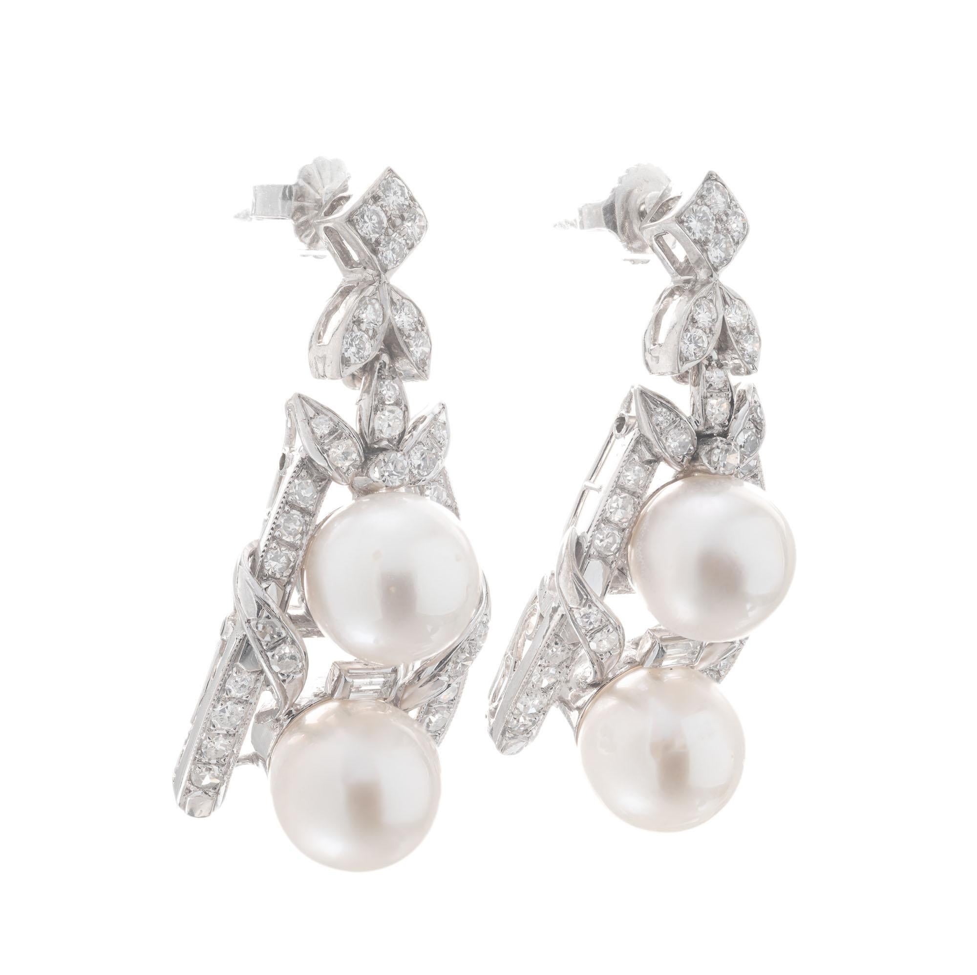 1960’s diamond a pearl dangle earrings. 4 round 8mm cultured pearls accented with 64 round brilliant cut and 2 baguette diamonds, in 14k white gold. 

4 cultured white gray pearls, 9mm
64 round brilliant cut diamonds, F-G SI approx. 1.50cts
2