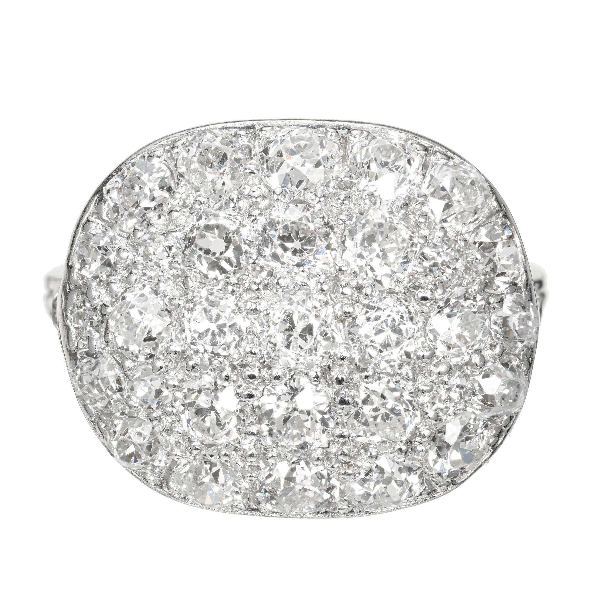 Diamond cluster ring. Domed handmade platinum setting with 35 round pave set old European cut diamonds, circa 1910.   

35 round old European diamonds, H-I SI approx. 1.54cts
Size 6.5 and sizable 
Platinum 
Stamped: Platinum 
4.5 grams
Width at top: