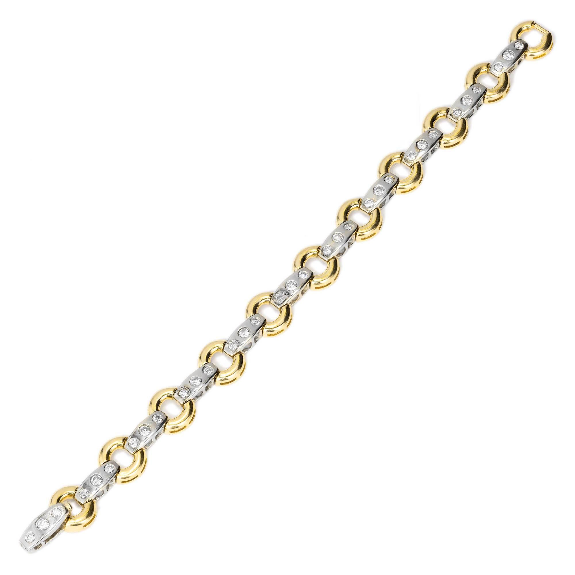 14k Yellow gold circle and white gold bar link bracelet. Well-polished and built in catch. Circa 1980.

33 round diamonds, approx. total weight 2.20ct, H, SI
14k yellow and white gold
22.0 grams
Tested and stamped: 14k
Hallmark: D
Length: 7