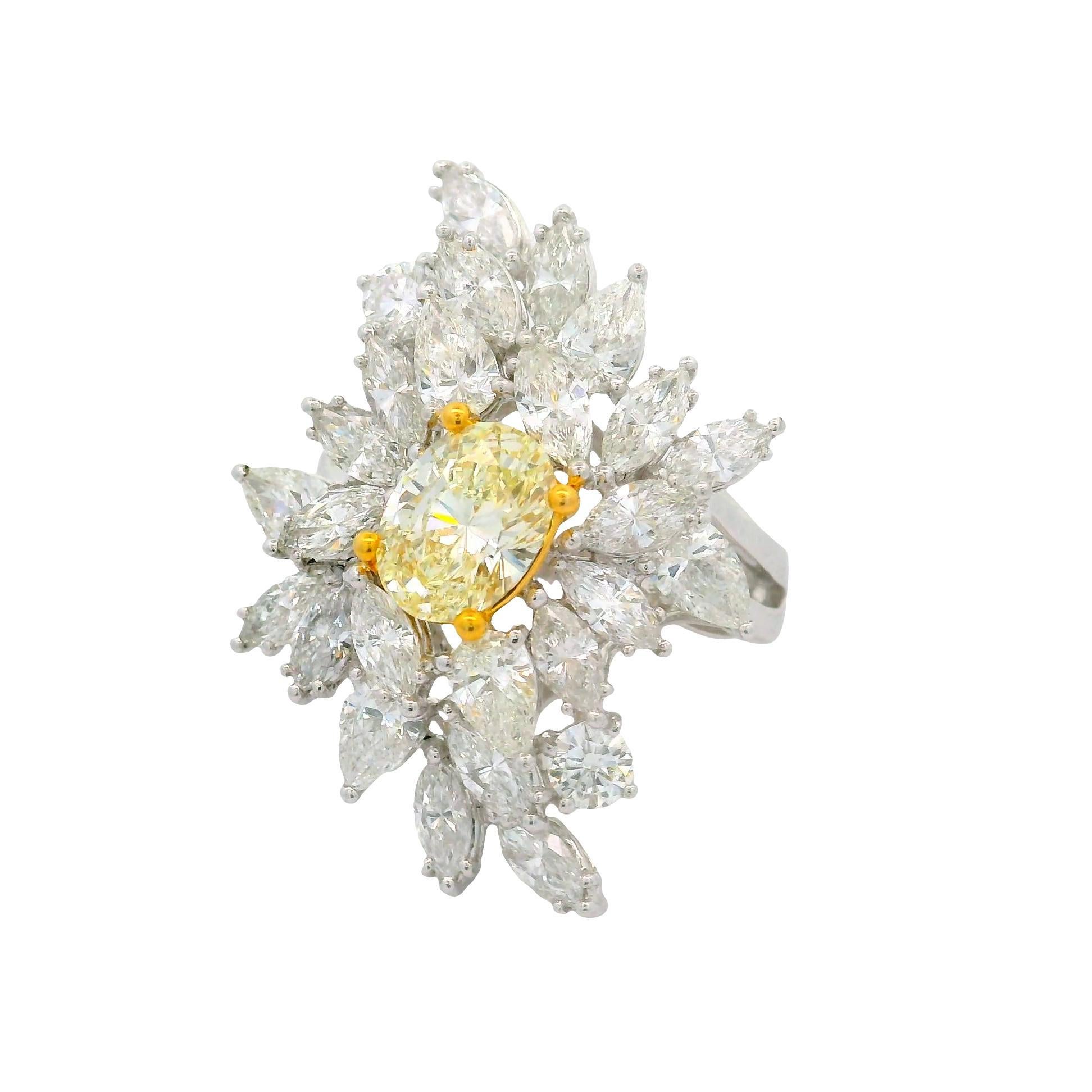 Contemporary 1.54 Carat Fancy Yellow Oval Diamond Cluster Platinum Ring For Sale