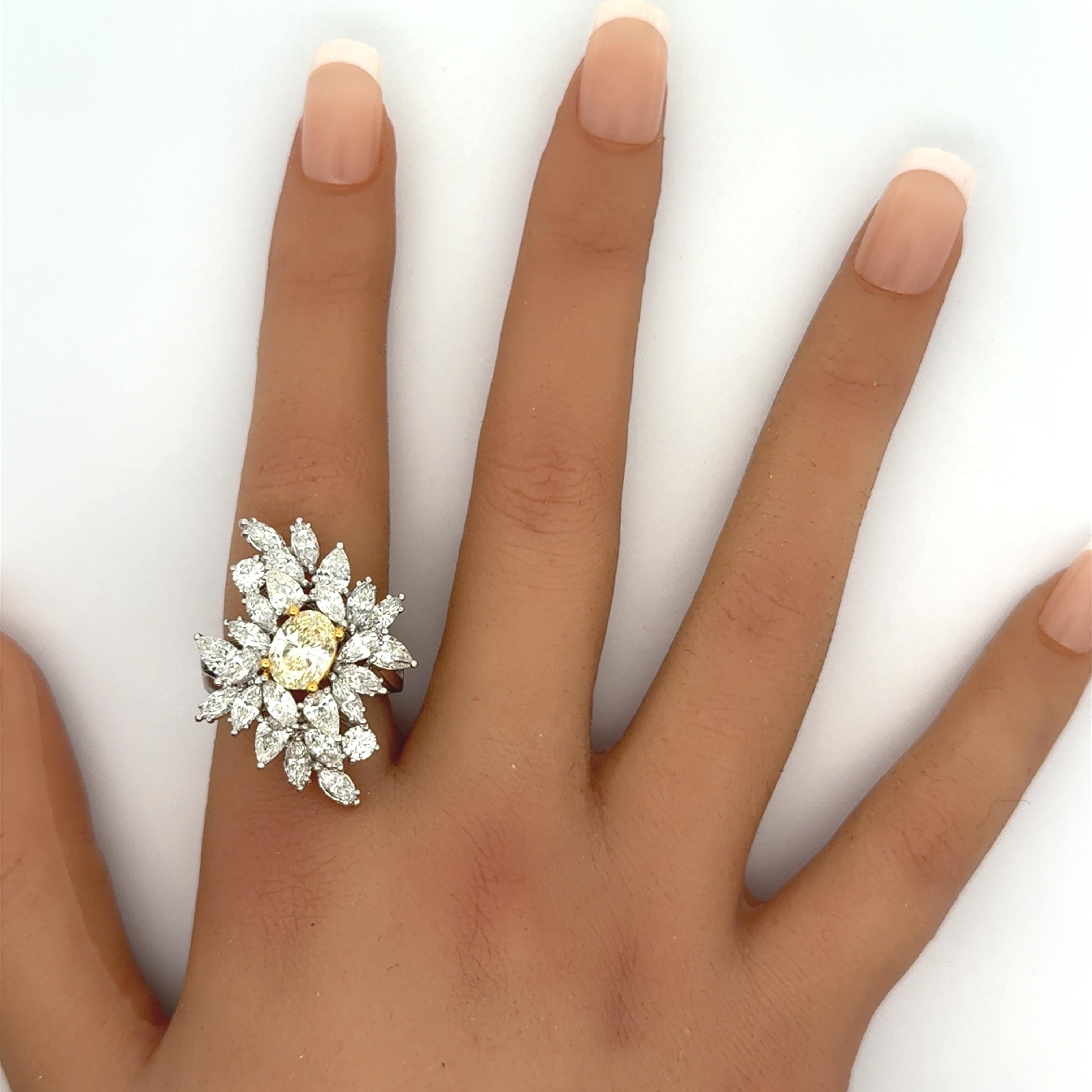 Women's 1.54 Carat Fancy Yellow Oval Diamond Cluster Platinum Ring For Sale