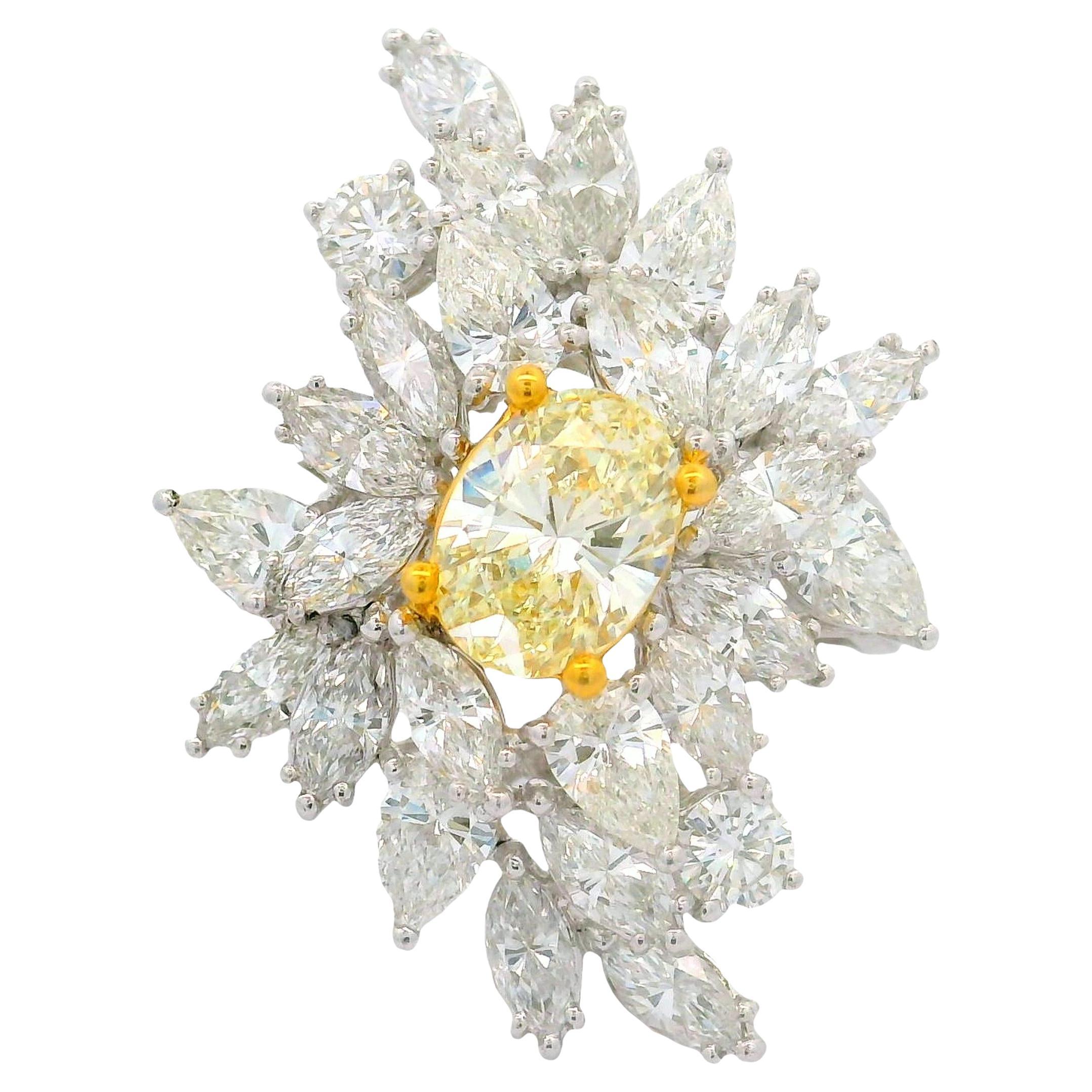 1.54 Carat Fancy Yellow Oval Diamond Cluster Platinum Ring For Sale