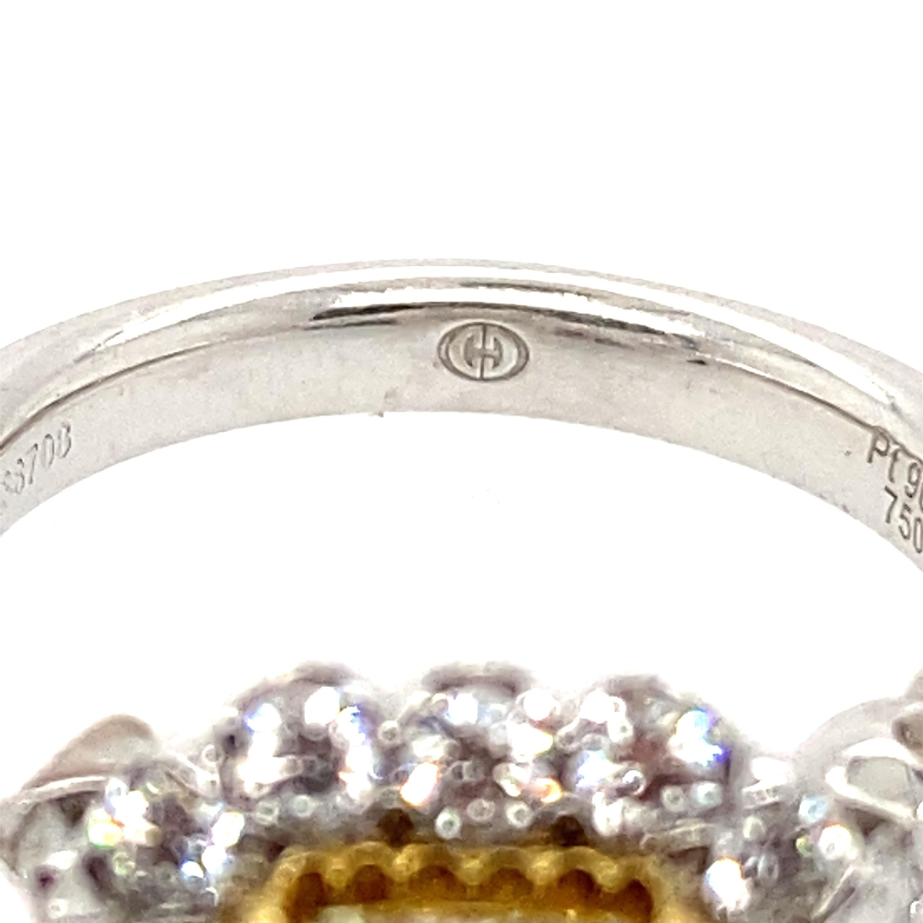 1.54 Carat Fancy Light Yellow, VVS1  Clarity. The center looks more vibrant as it is framed in 18 karat Yellow gold diamonds. The brighter the Yellow the more expensive the diamond. 
Dazzling ring can be worn as a right hand ring or is a stunning