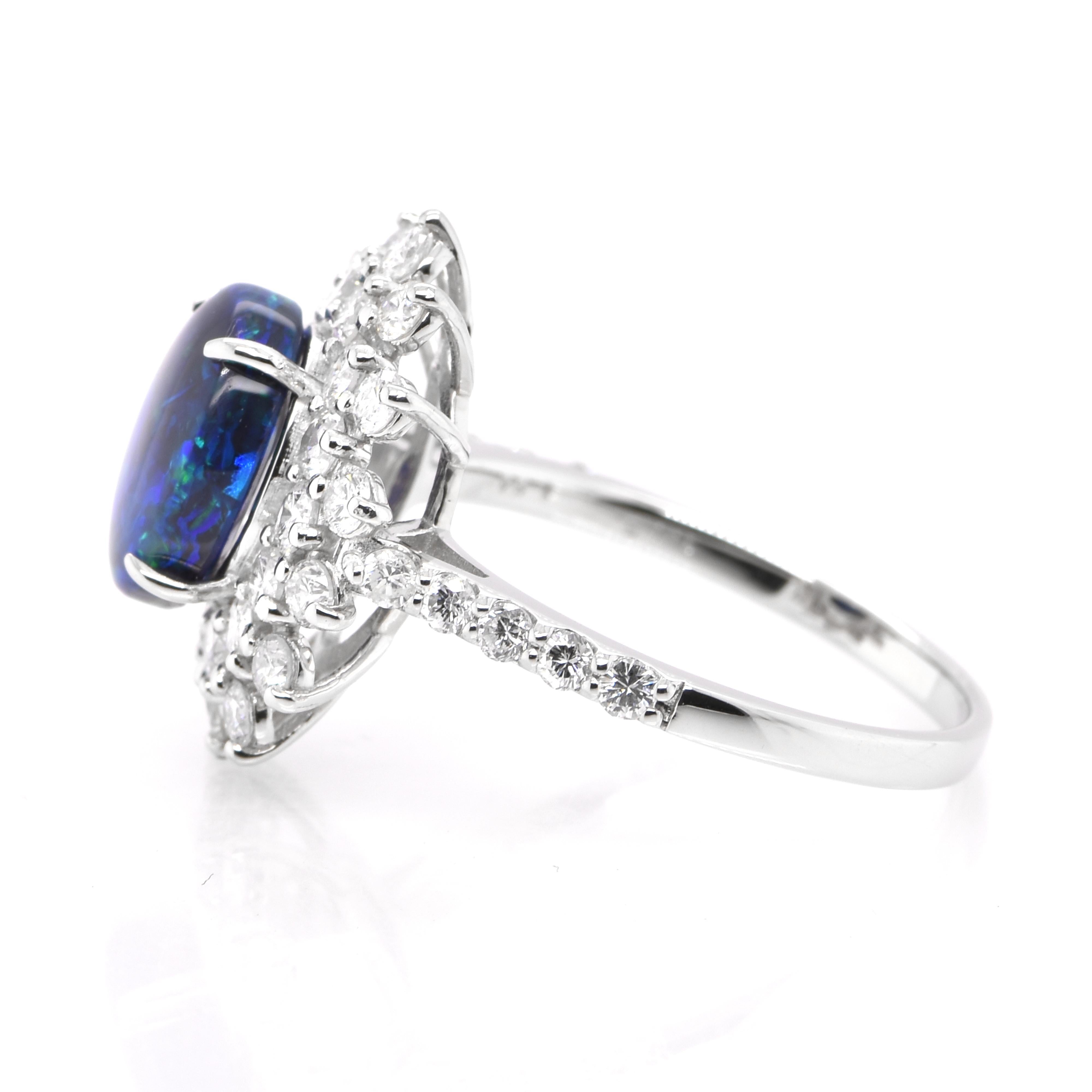 Cabochon 1.54 Carat Lighting Ridge Black Opal & Diamond Halo Ring Set in Platinum For Sale