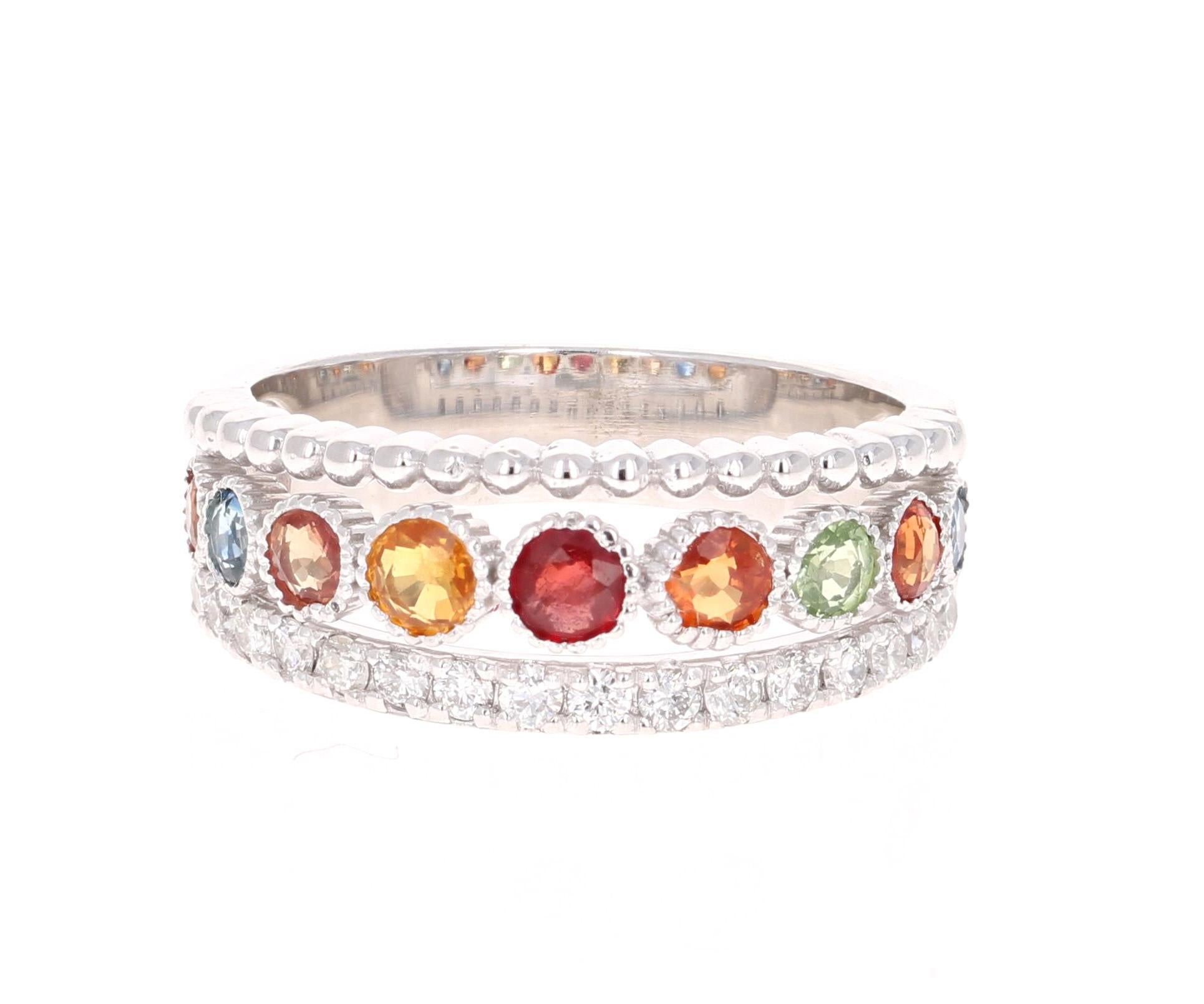 A Uniquely designed Multi-Colored Sapphire and Diamond Band that is sure to be a great addition to your jewelry collection!  
This band has 9 Round Cut Multi-Colored Sapphires that weigh 1.24 carats which are accented by a row of 16 Round cut