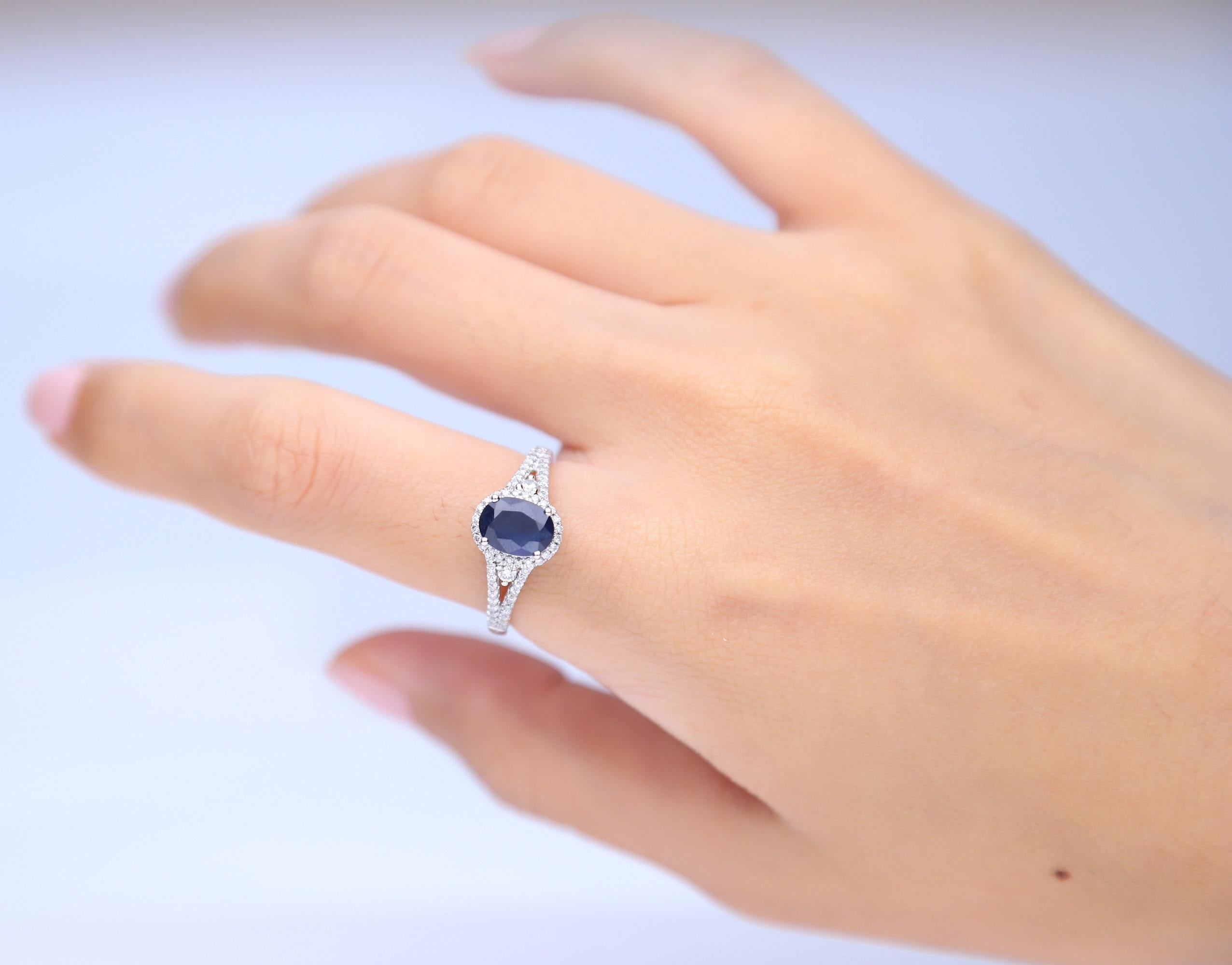 Decorate yourself in elegance with this Ring is crafted from 10-karat White Gold Gold by Gin & Grace. This Ring is made up of 6*8 mm Oval-cut (1 pcs) 1.54 carat Blue Sapphire and Round Cut Diamond (66 Pcs) 0.32 Carat . This Ring is weight 2.33