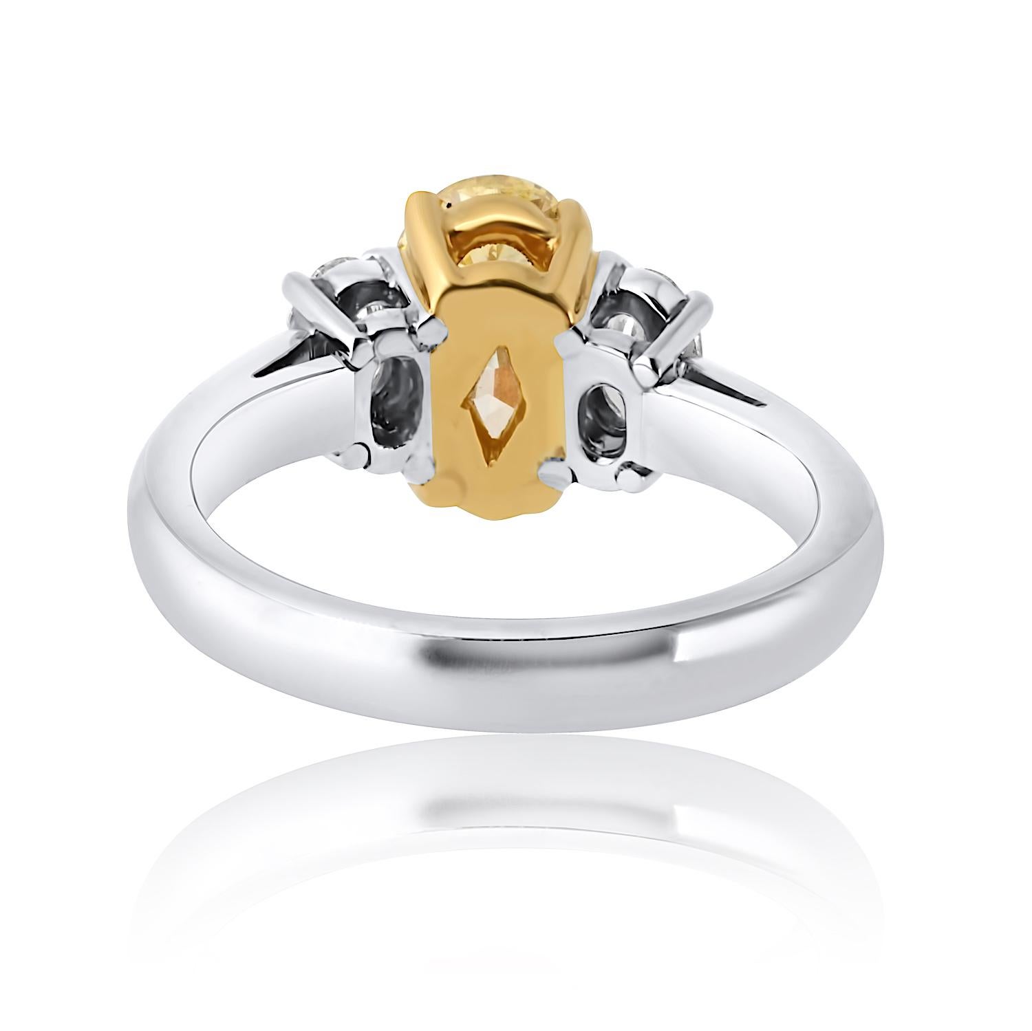 1.54 Carat Oval Cut Fancy Intense Yellow Three-Stone Diamond Engagement Ring In New Condition For Sale In New York, NY