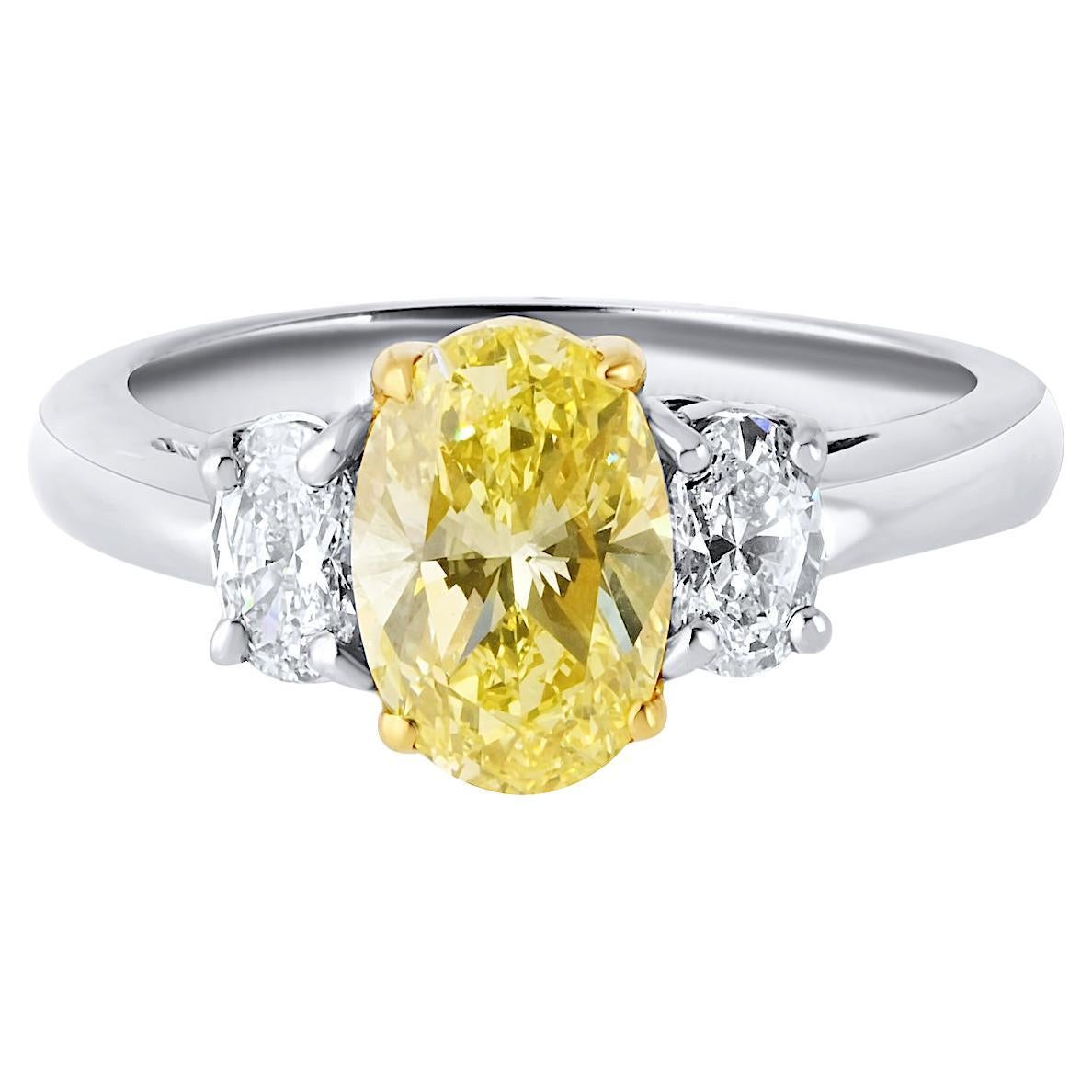 1.54 Carat Oval Cut Fancy Intense Yellow Three-Stone Diamond Engagement Ring