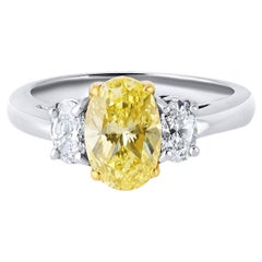 1.54 Carat Oval Cut Fancy Intense Yellow Three-Stone Diamond Engagement Ring