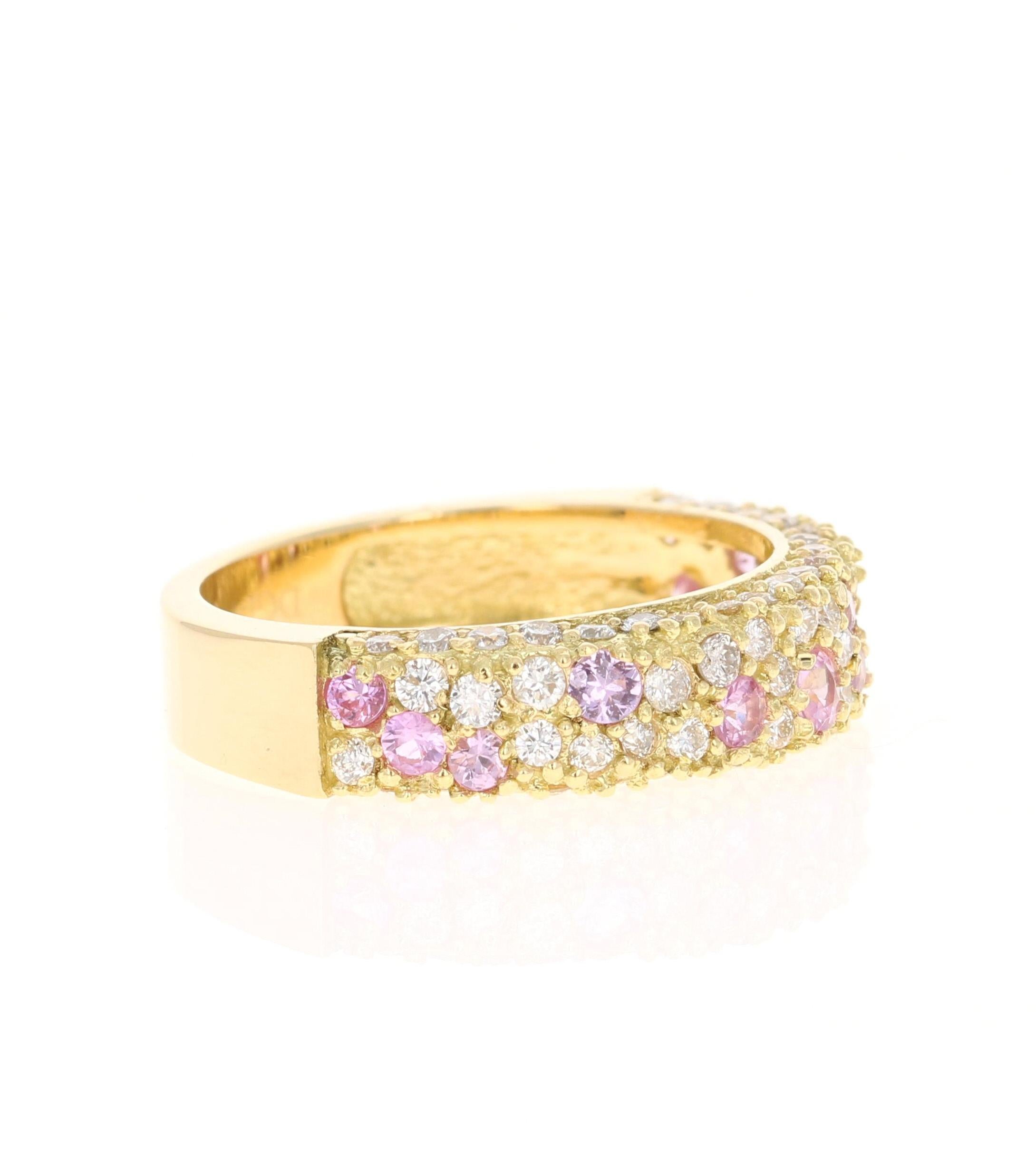 This gorgeous band has 16 Light Pink Sapphires that weigh 0.74 carats and 59 Round Cut Diamonds that weigh 0.80 carats. (Clarity: VS, Color: H) The total carat weight of the ring is 1.54 carats. 

The ring is designed in 18 Karat Yellow Gold and