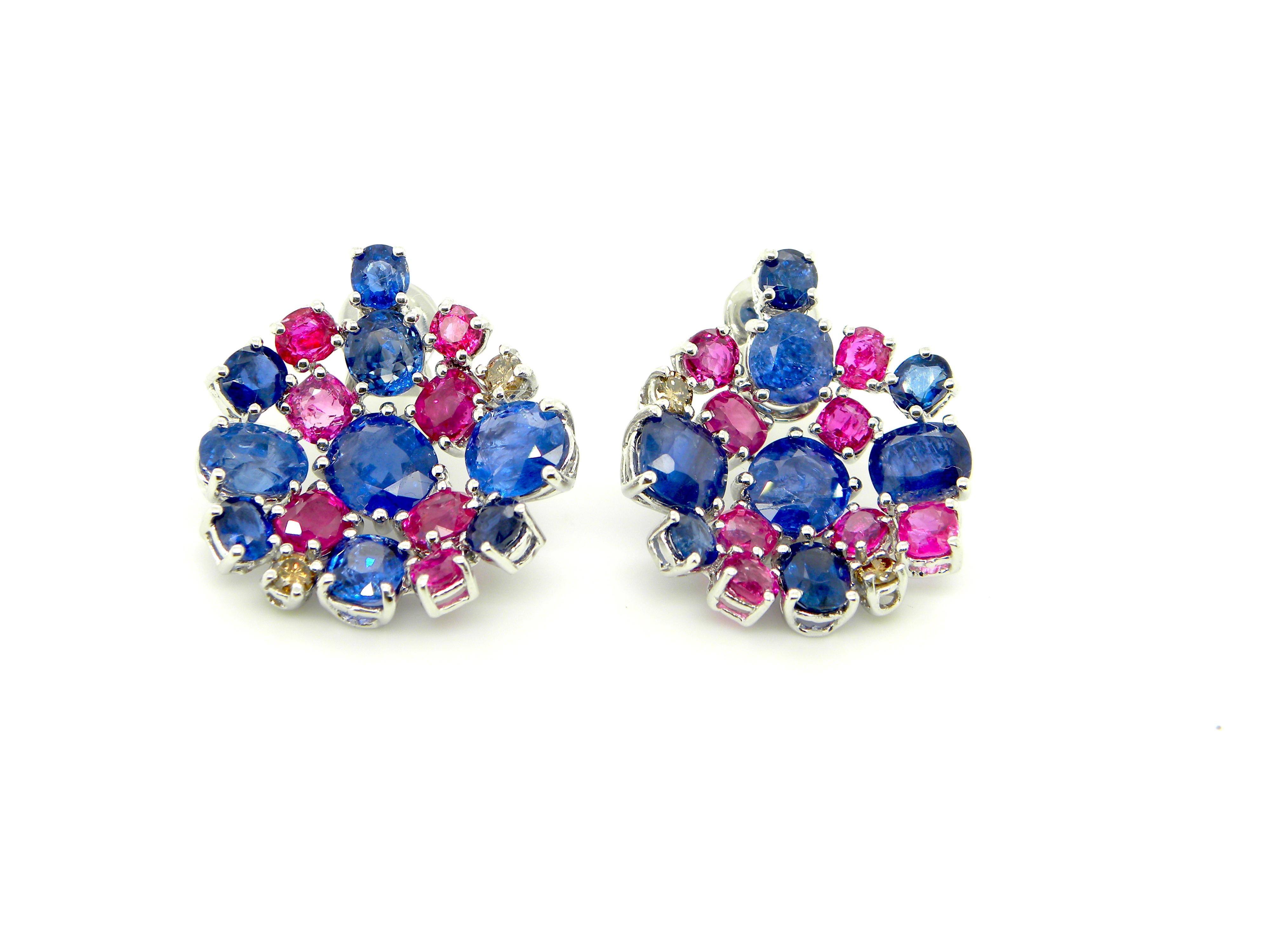 15.4 Carat Unheated Burmese Ruby and Blue Sapphire White Gold Cluster Earrings: 

An elegant pair of earrings, it features numerous unheated Burmese rubies and blue sapphires weighing a total of 15.4 carat with interspersed brown diamonds weighing a