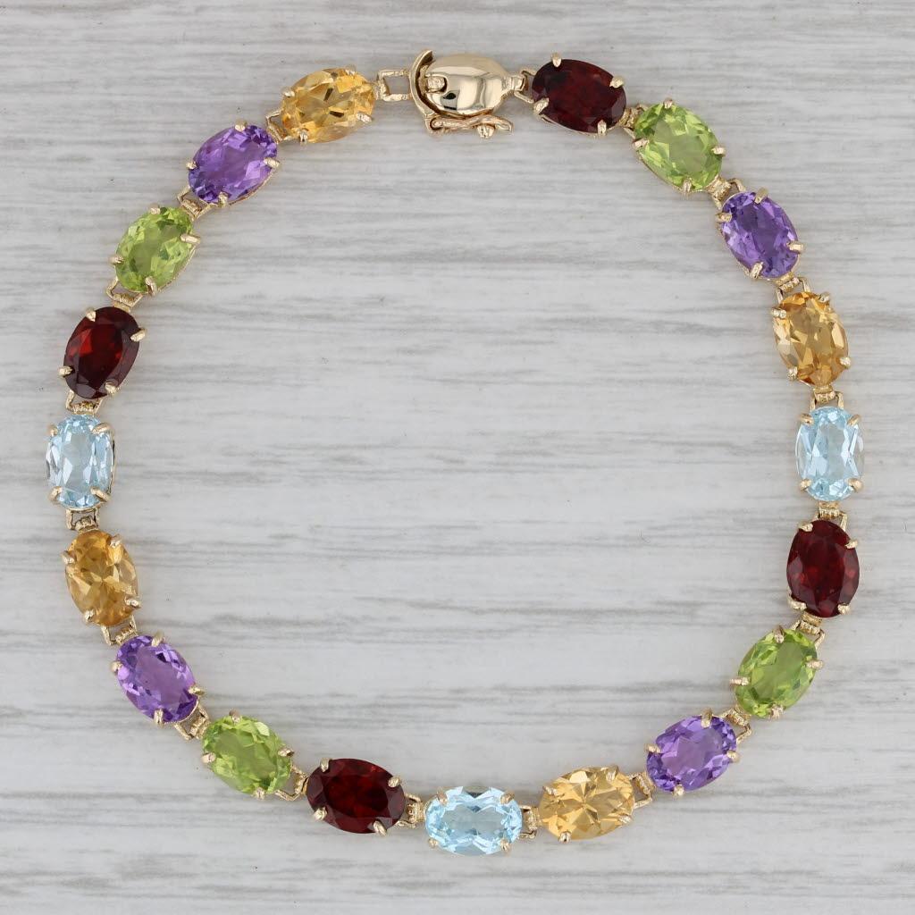 Taille ovale Bracelet tennis en or 14 carats avec citrine, améthyste, péridot, grenat et topaze de 15,42 carats