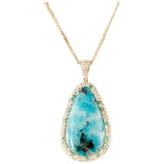 15.43 Carat Paraiba Tourmaline Pearshape Pendant with Diamond Halo in 18kyg