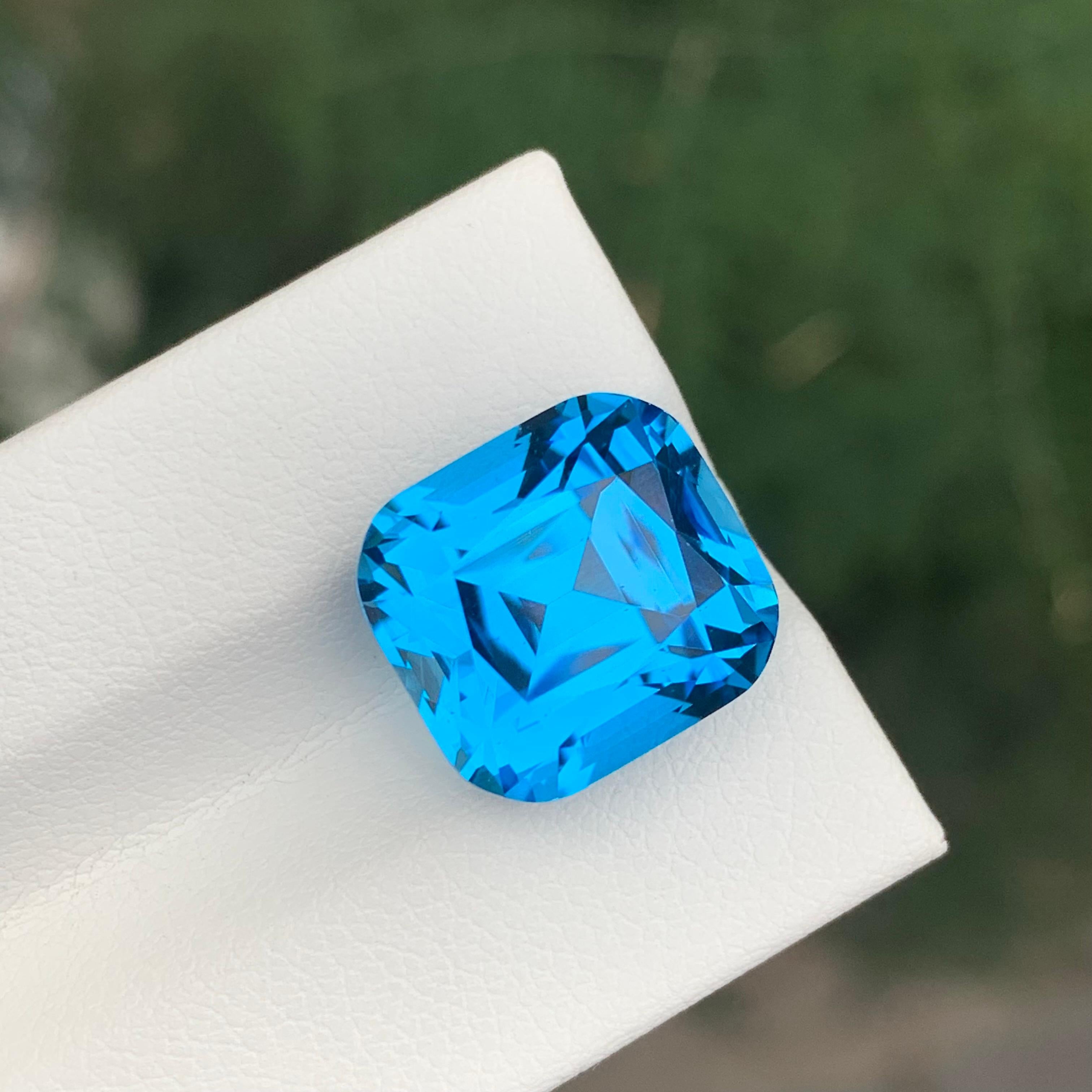 Loose Swiss Blue Topaz

Weight: 15.45 Carats
Dimensions: 12.8 x 11.9 x 10.8 Mm
Origin: Brazil
Shape: Cushion
Color: Blue
Certificate: On Demand

Benefits Of Wearing Blue Topaz Stone:
It helps to improve communication and self-expression.
It provides