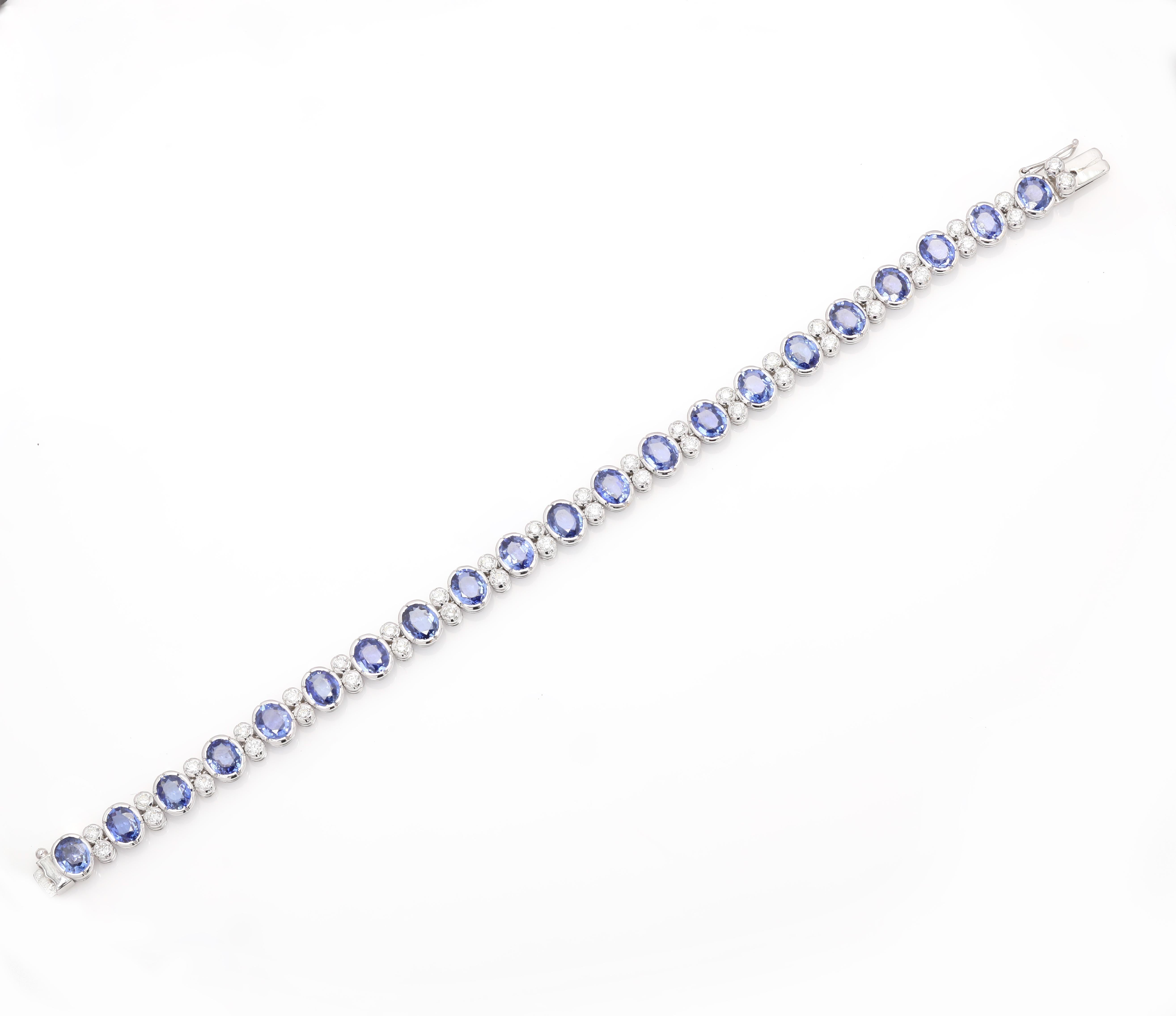 This Diamond Blue Sapphire Wedding Tennis Bracelet in 18K gold showcases 21 endlessly sparkling natural sapphire , weighing 15.45 carat. It measures 7.25 inches long in length. 
Sapphire stimulates concentration and reduces stress. 
Designed with