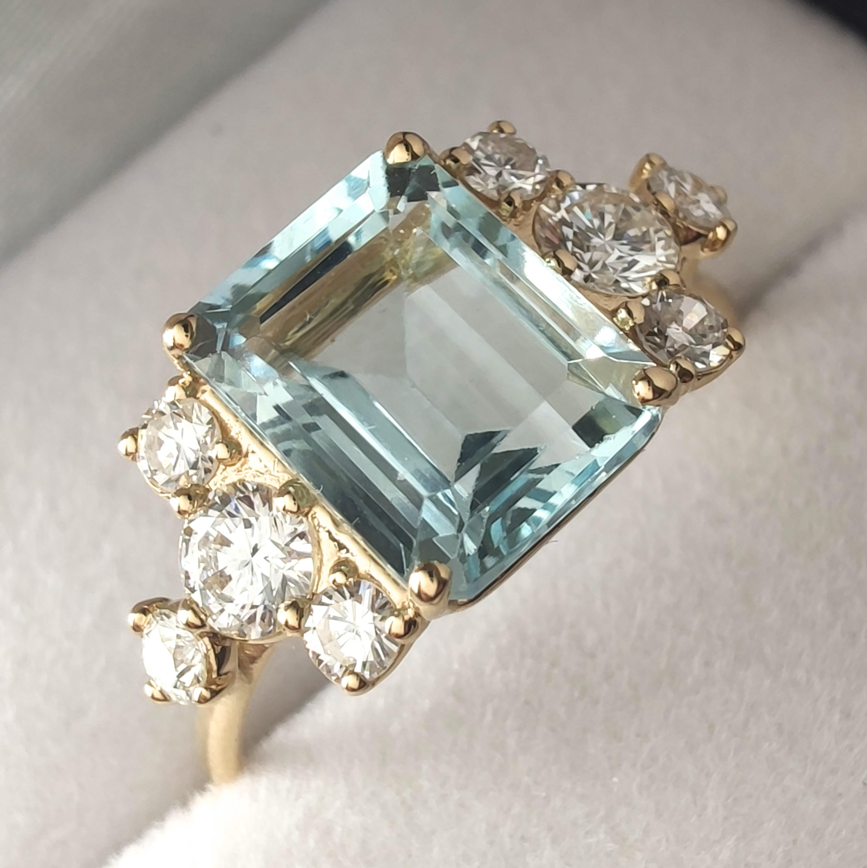 1.54ct Natural Aquamarine and Diamond Ring in 18K Yellow Gold – Handmade Contemporary Design

This one-of-a-kind handcrafted ring in solid 18K yellow gold features a luminous 1.54-carat natural aquamarine, cut in a refined emerald shape and set with