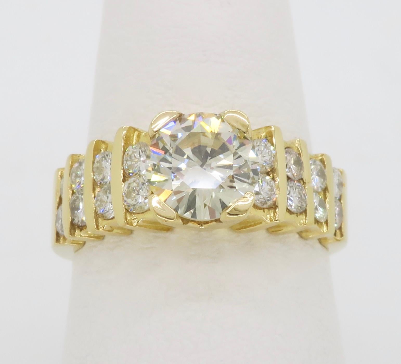 Diamond encrusted ring crafted in 14k Yellow Gold with 1.54ctw of Diamonds. 

Center Diamond Carat Weight: .98CT
Center Diamond Cut: Round Brilliant
Center Diamond Color: M
Center Diamond Clarity: VS1
Total Diamond Carat Weight: Approximately