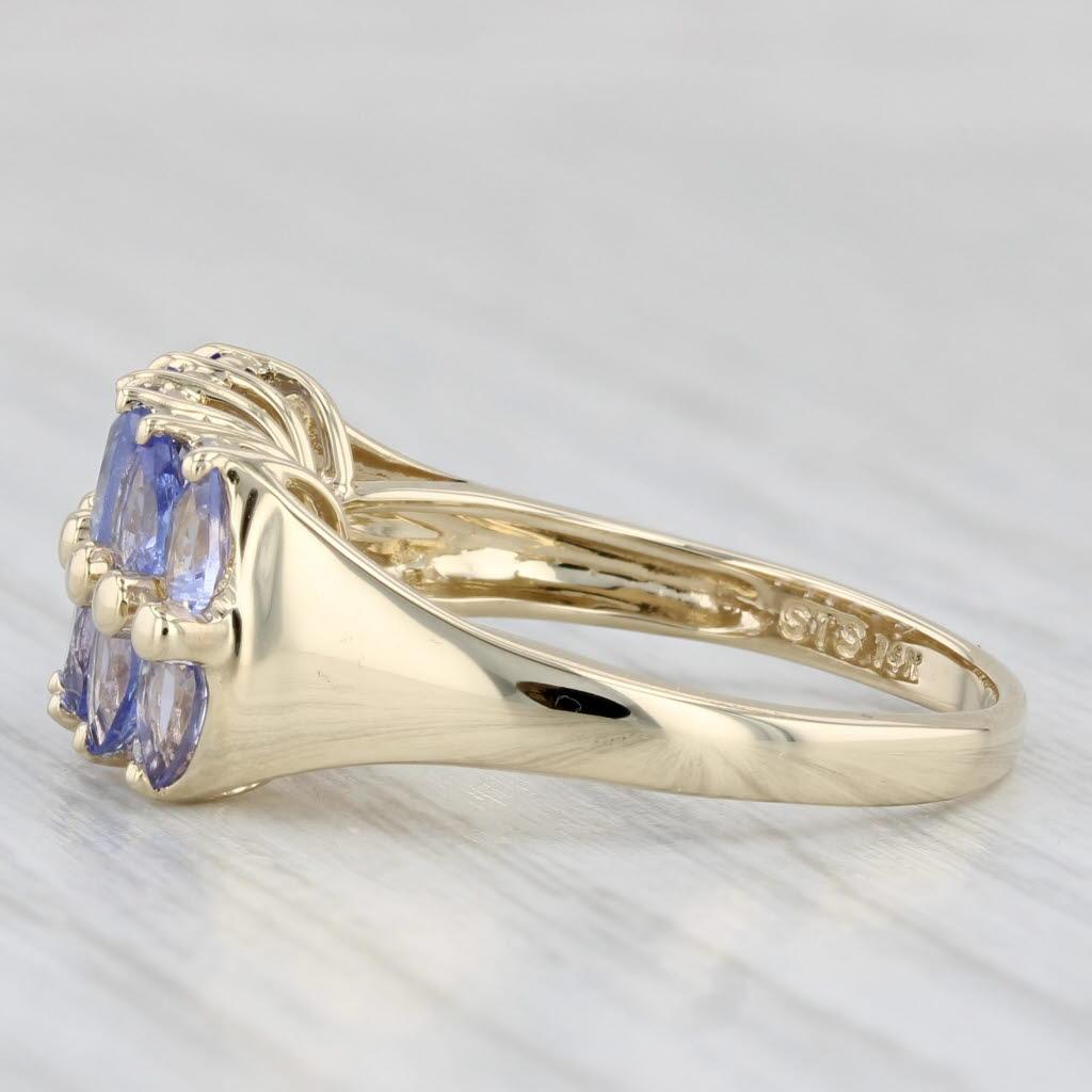 Gemstone Information:
- Natural Tanzanites -
Total Carats - 1.54ctw
Cut - Pear Brilliant
Color - Purple
Treatment - Heated

- Natural Diamonds -
Total Carats - 0.04ctw
Cut - Round Brilliant
Color - H - I
Clarity - VS2

Metal: 14k Yellow Gold
Weight: