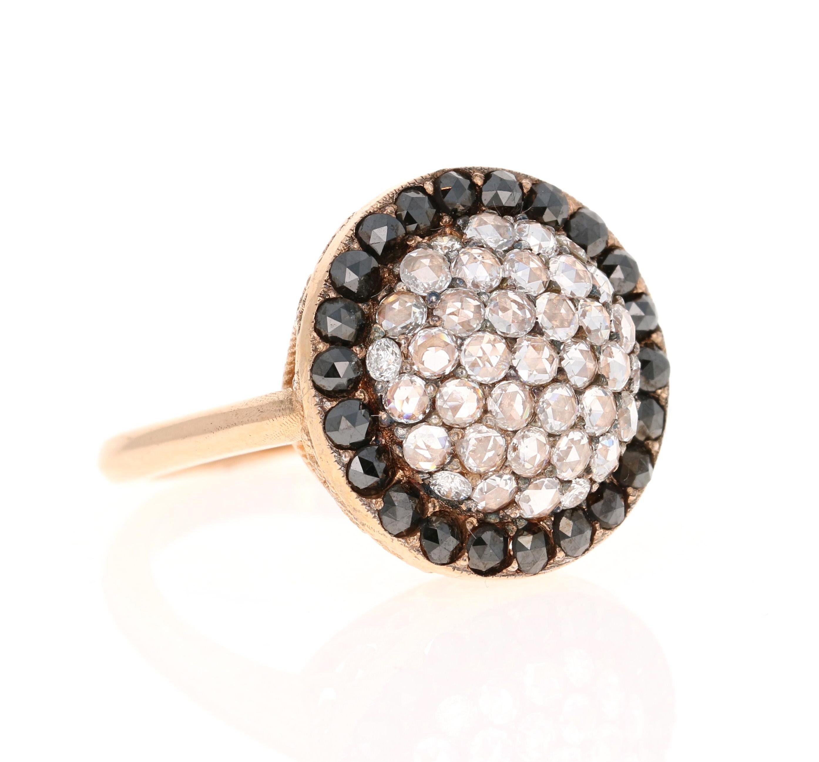This ring is set with 38 Rose Cut Diamonds that weigh 0.58 carats and is further embellished with 22 Black Diamonds that weigh 0.97 carats. The total carat weight of the ring is 1.55 carats. 

It is beautifully set in 18 Karat Rose Gold and is