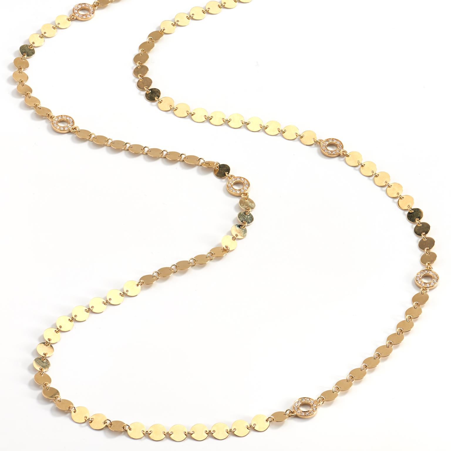 Let your playful side shine with the help of six pave-set diamond dials with a total weight of 1.55 carats dancing, accompanied by 14 karat yellow gold round discs, held together in a 33 inch necklace.