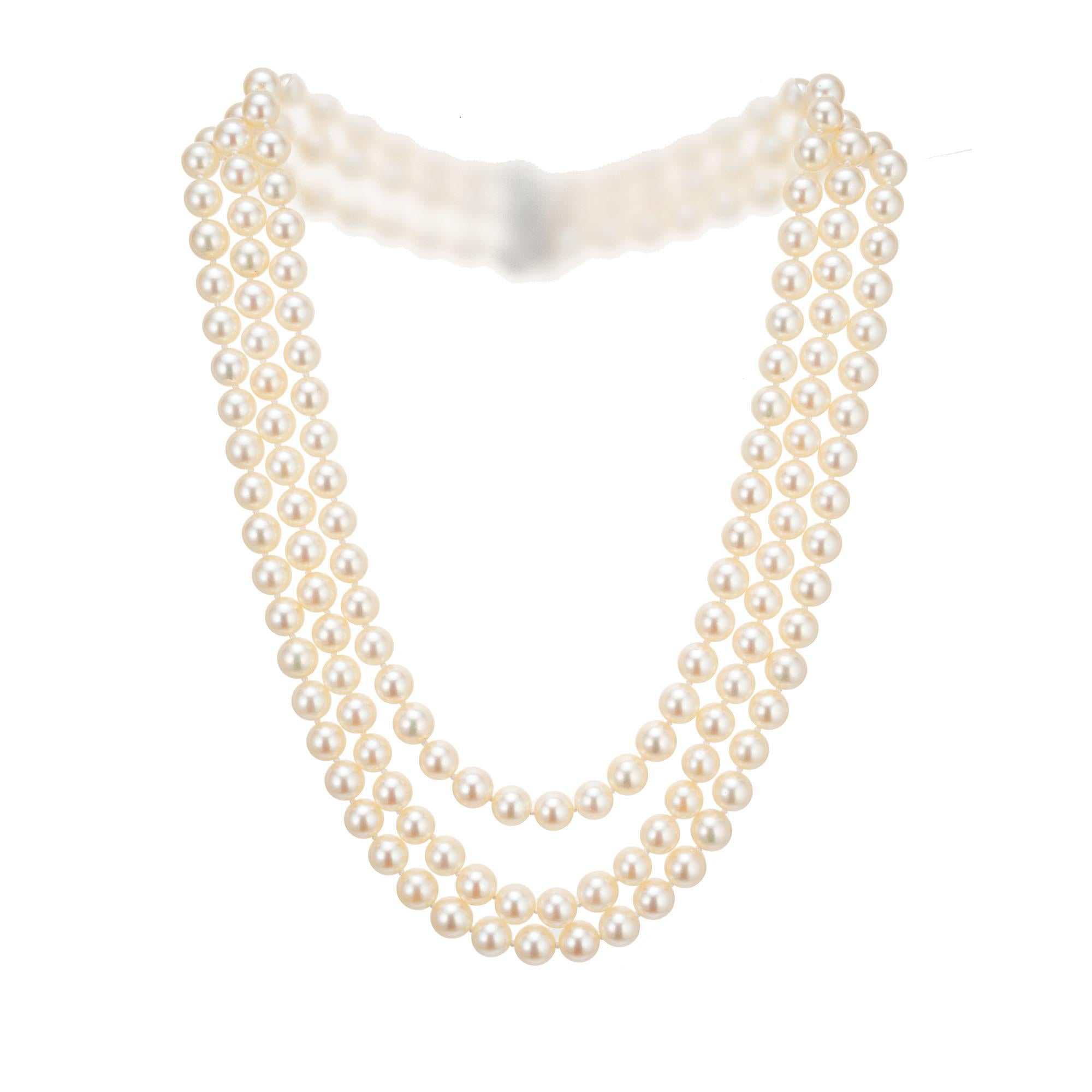 Mid-Century 1950’s triple strand cultured pearl necklace. 14k white gold catch with baguette, marquise and round accent diamonds. 17, 18, 19 inches in length. 

170 cultured crème hue pearls, excellent lustre, few blemishes, well matched
5 marquise
