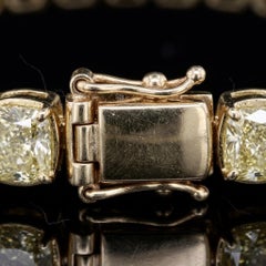 Bracelet tennis en or 18 carats serti d'un diamant jaune « Fancy » de 15,5 carats