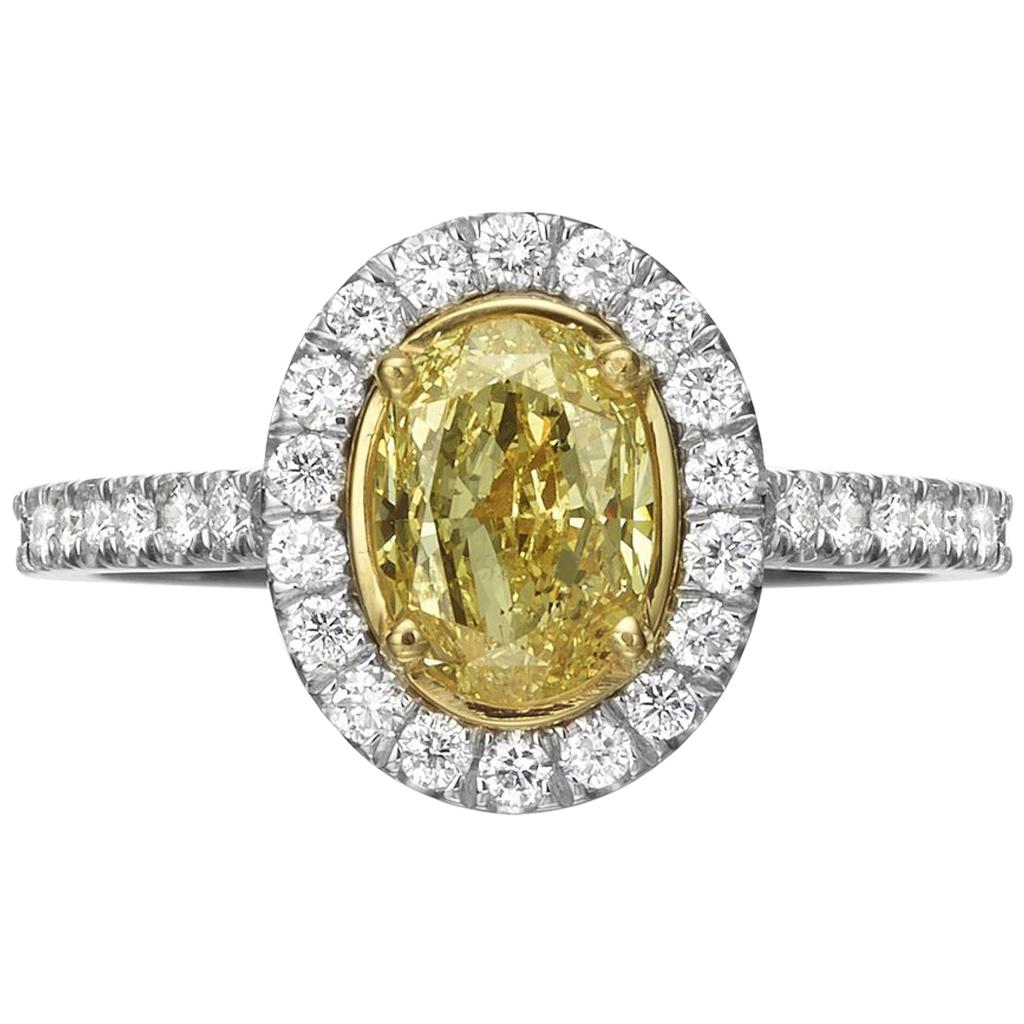 1.55 Carat Fancy Yellow Oval Cut Diamond Engagement Ring For Sale