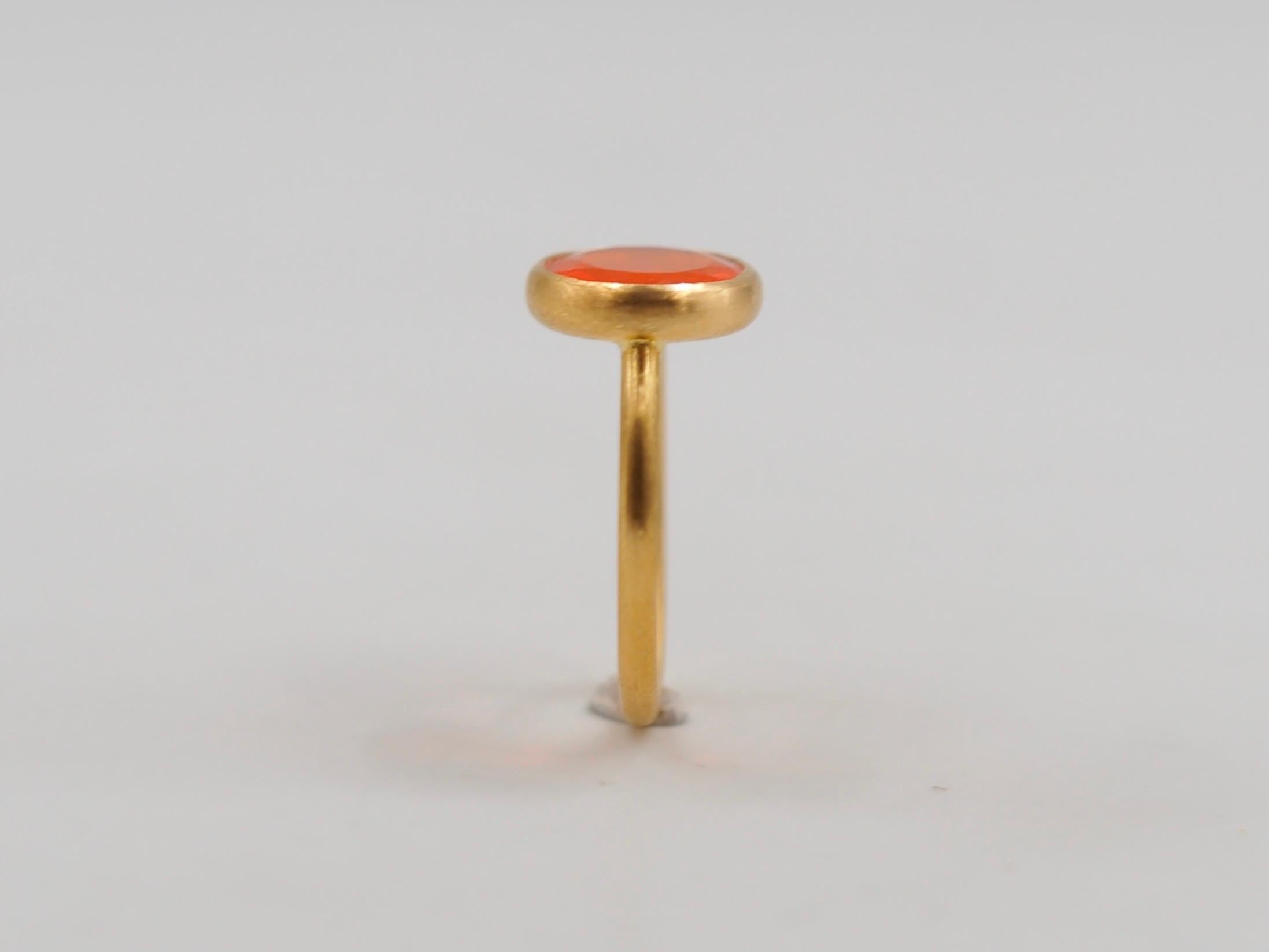This simple ring by Scrives is composed of Fire Opal from Mexico of 1.55 cts.
The stone is set in a 22kt closed gold setting.
This stone is natural and has natural & typical play of color and inclusions (non eye-visible). Opal are fragile stones,