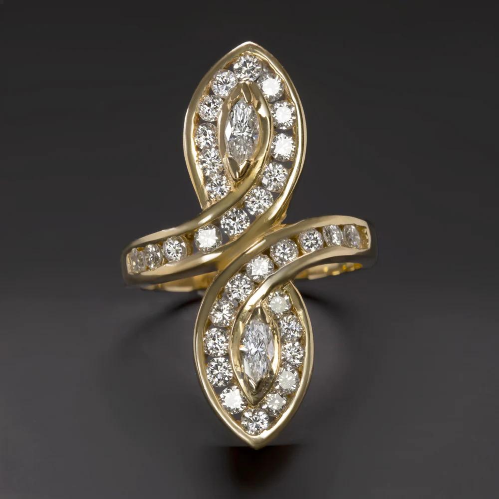 Beautifull diamond cluster cocktail ring with 1.55 Ct of brilliant diamonds.
This ring is Featuring a pair of marquise cut diamonds encircled by ribbons of brilliant accent diamonds.
Setting in 14k yellow gold this ring has a unique and beautiful