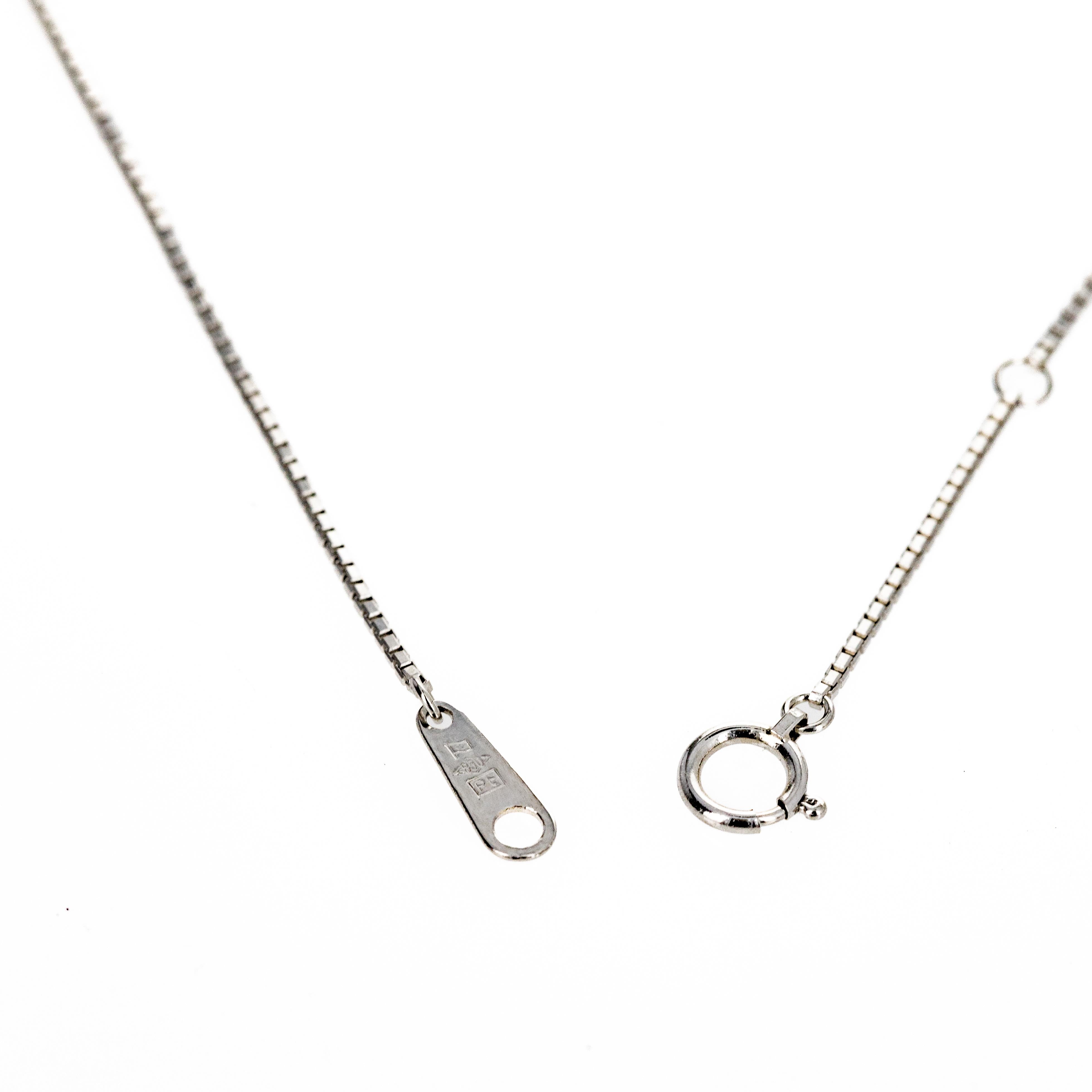 Era: Modern Estate

Composition: Platinum
Primary Stone: Emerald Cut Natural Emerald
Carat Weight: 1.55 Carats
Accent Stone: Fourteen Round Brilliant Diamonds
Carat Weight: 0.72 Carats in Total
Color/Clarity: G-H / VS1-2
Necklace Length: 17.75