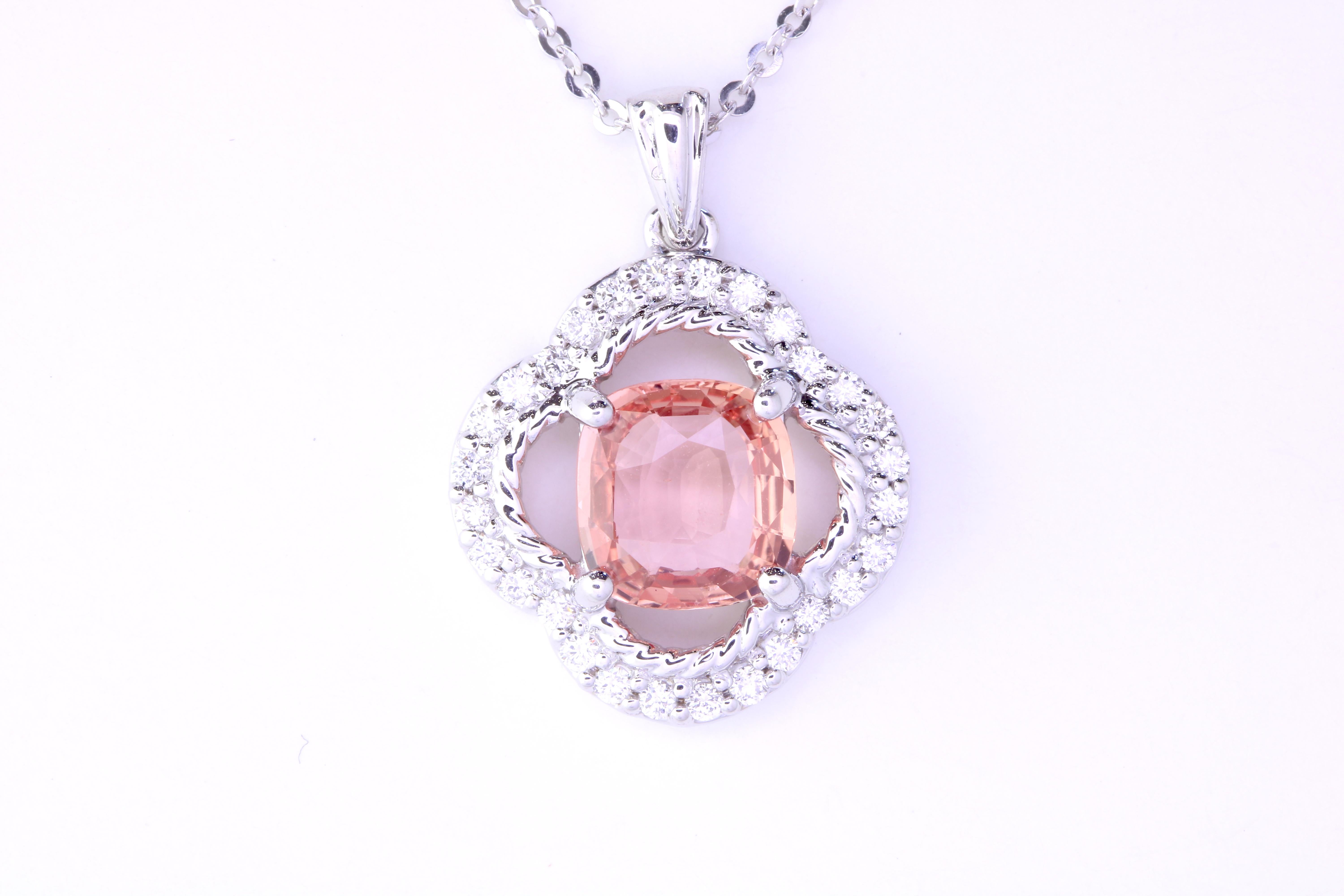 An illuminating 1.55 carat Padparadscha Sapphire is the star of this piece. Set in 14k White Gold and surrounded with 28 brilliant round diamonds totaling 0.24 carat, you will be the center of attention!

Material: 14k White Gold 
Center Stone