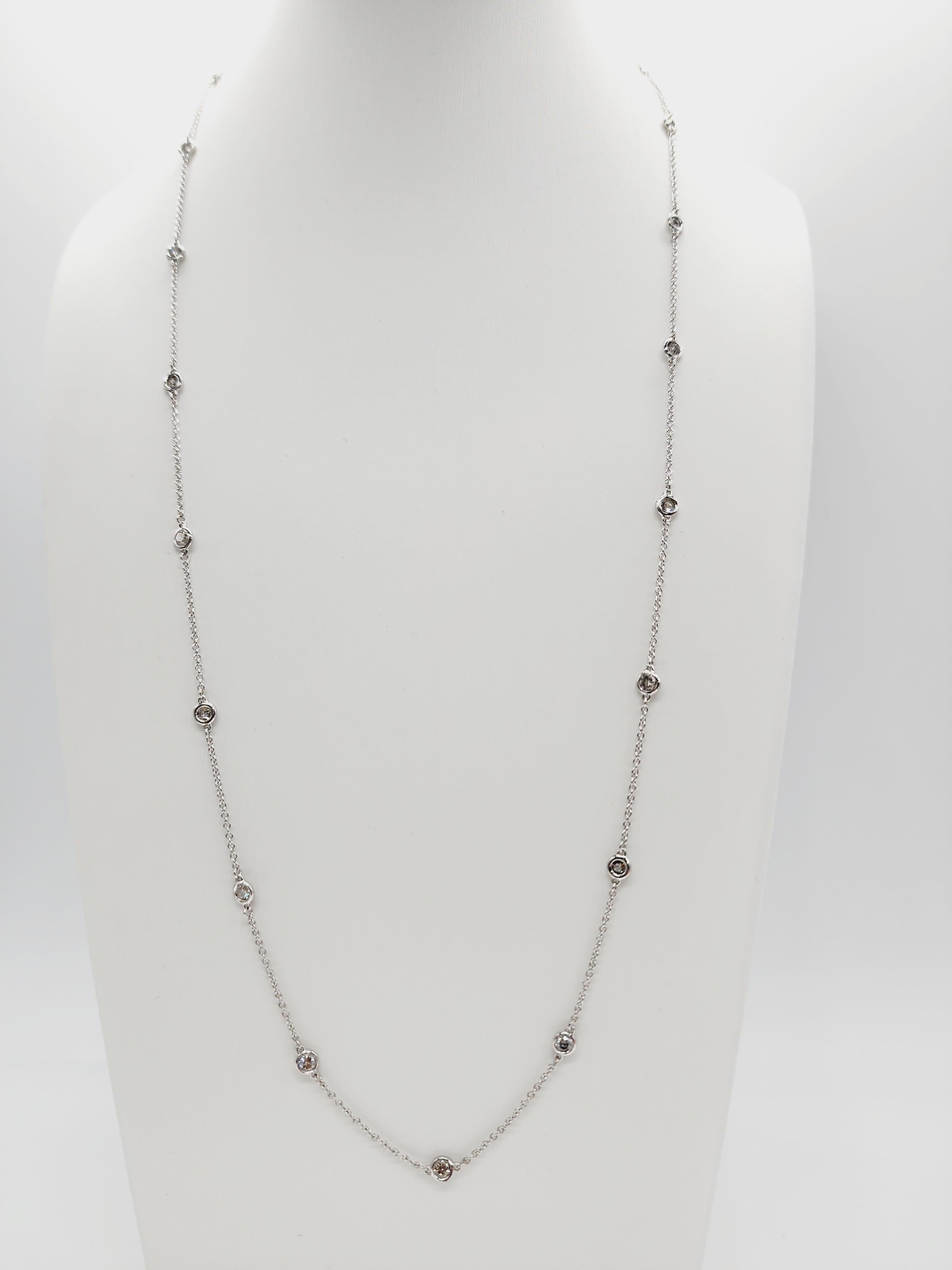 19 Station Diamond by the yard necklace set in Italian made 14K white gold. 
The total weight is 1.55 carats. The total length is 24 inch. Average G-I.