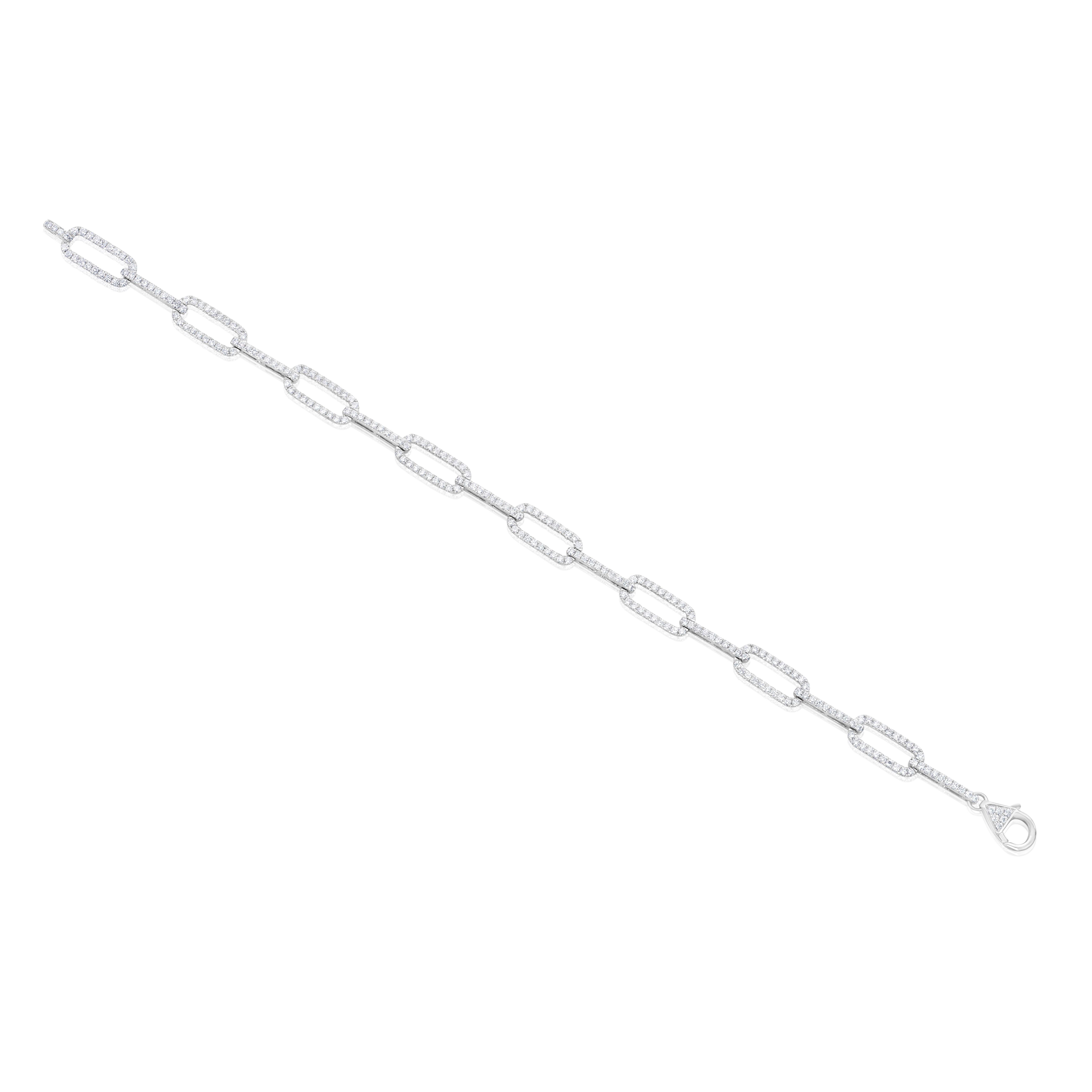 A fashionable link bracelet, featuring 264 round cut diamonds weighing 1.55 carats total, set with an elegant pavé setting. Lobster clasp is accented by a cluster of round cut diamonds. Finely made with 18K white gold, 7 inches in length. Perfect