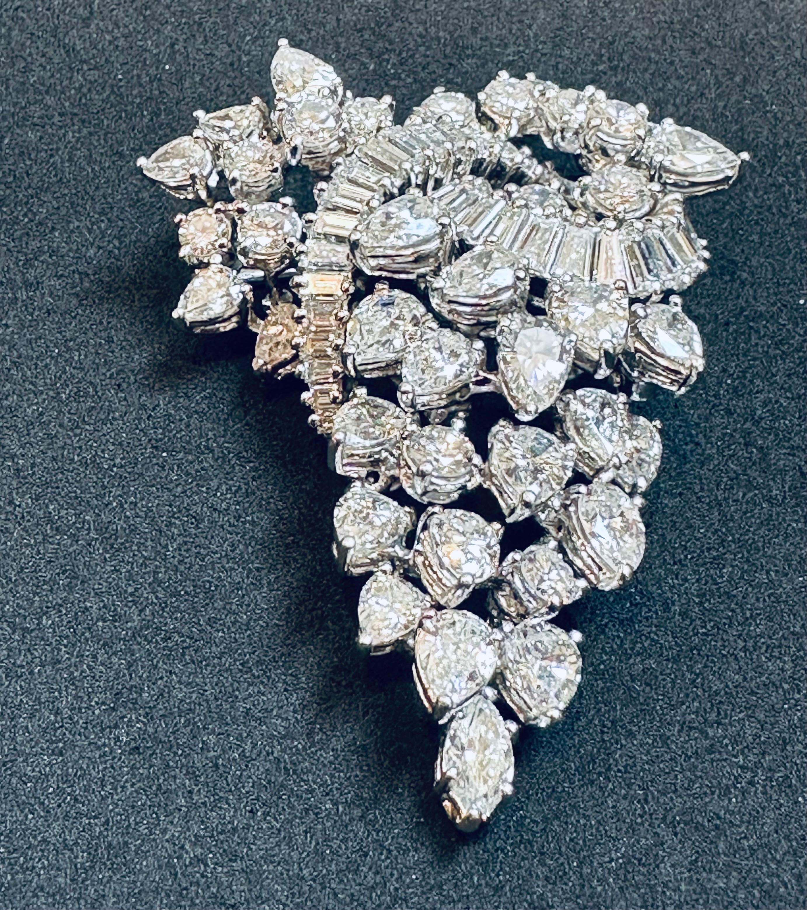 This Antique Diamond & Platinum Pin/Brooch/Pendant is a stunning piece of jewelry that has a total of 15.5 carats of diamonds. All of the diamonds are of the highest quality, with a VS rating. The diamonds are all large size, with 42 pear and