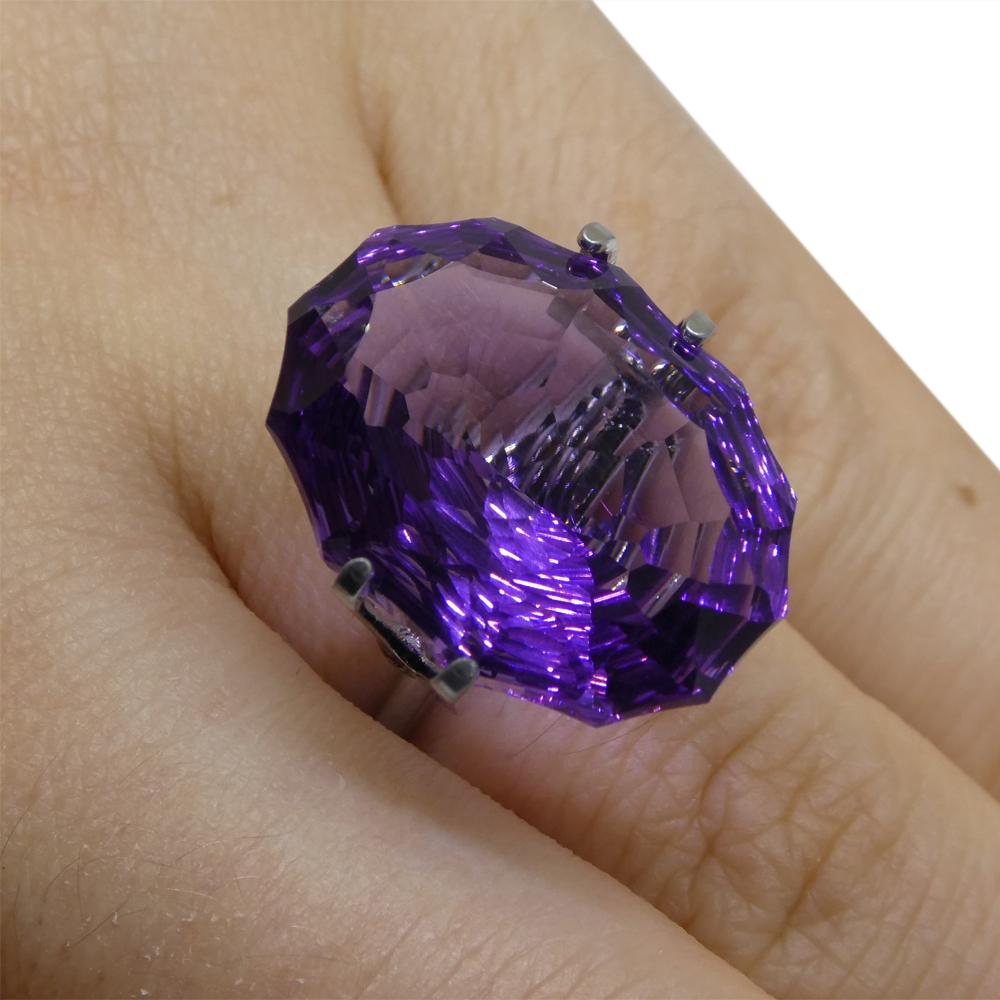 Description:

Gem Type: Amethyst
Number of Stones: 1
Weight: 15.5 cts
Measurements: 20.00 x 15.00 x 9.50 mm
Shape: Oval
Cutting Style Crown: Modified Brilliant
Cutting Style Pavilion: Mixed Cut
Transparency: Transparent
Clarity: Very Slightly